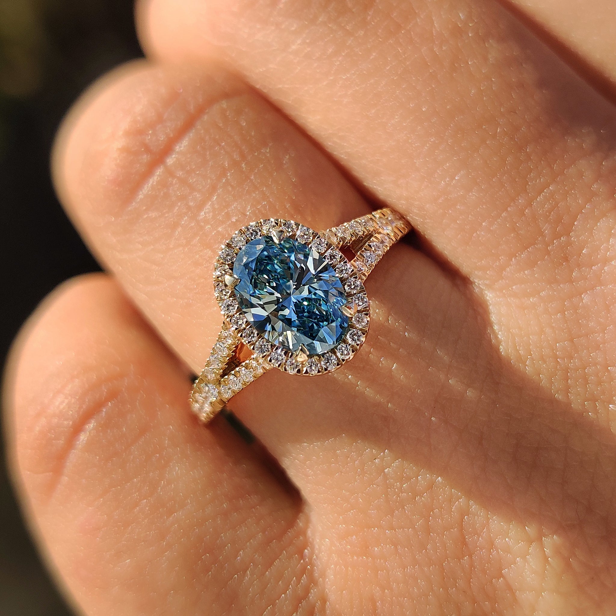 Oval engagement ring featuring pave setting and cathedral setting.
