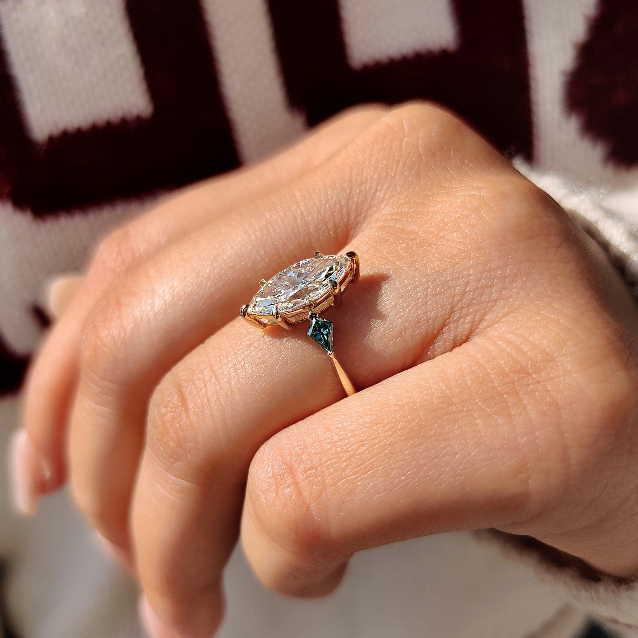 Six claw prong diamond ring with marquise cut.
