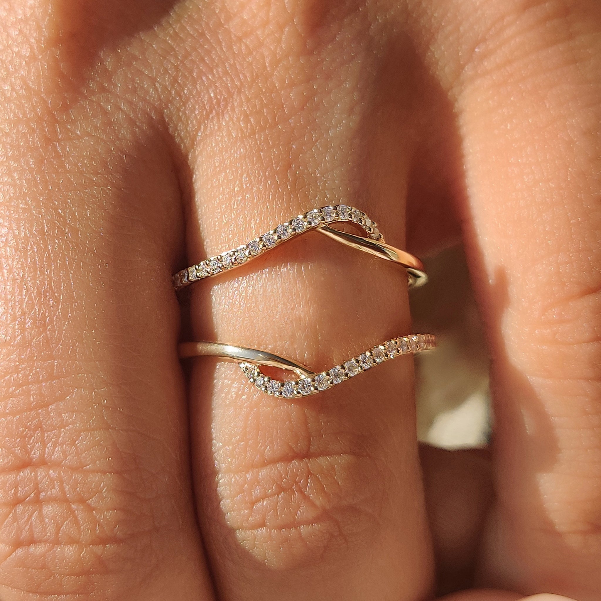 Custom wedding band designed as a wrap guard wedding band.
