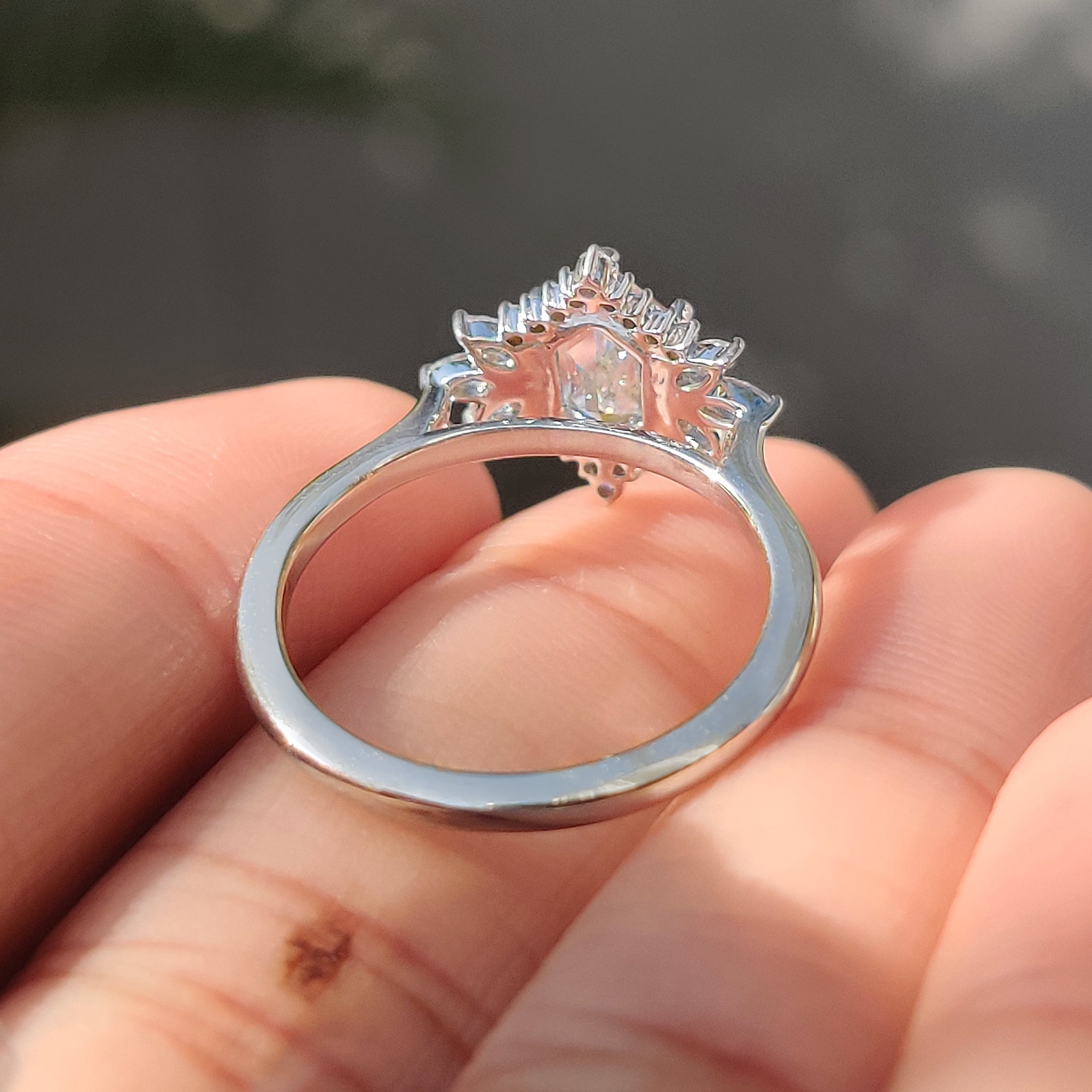 Handmade jewelry elongated hexagon ring with marquise side stones.
