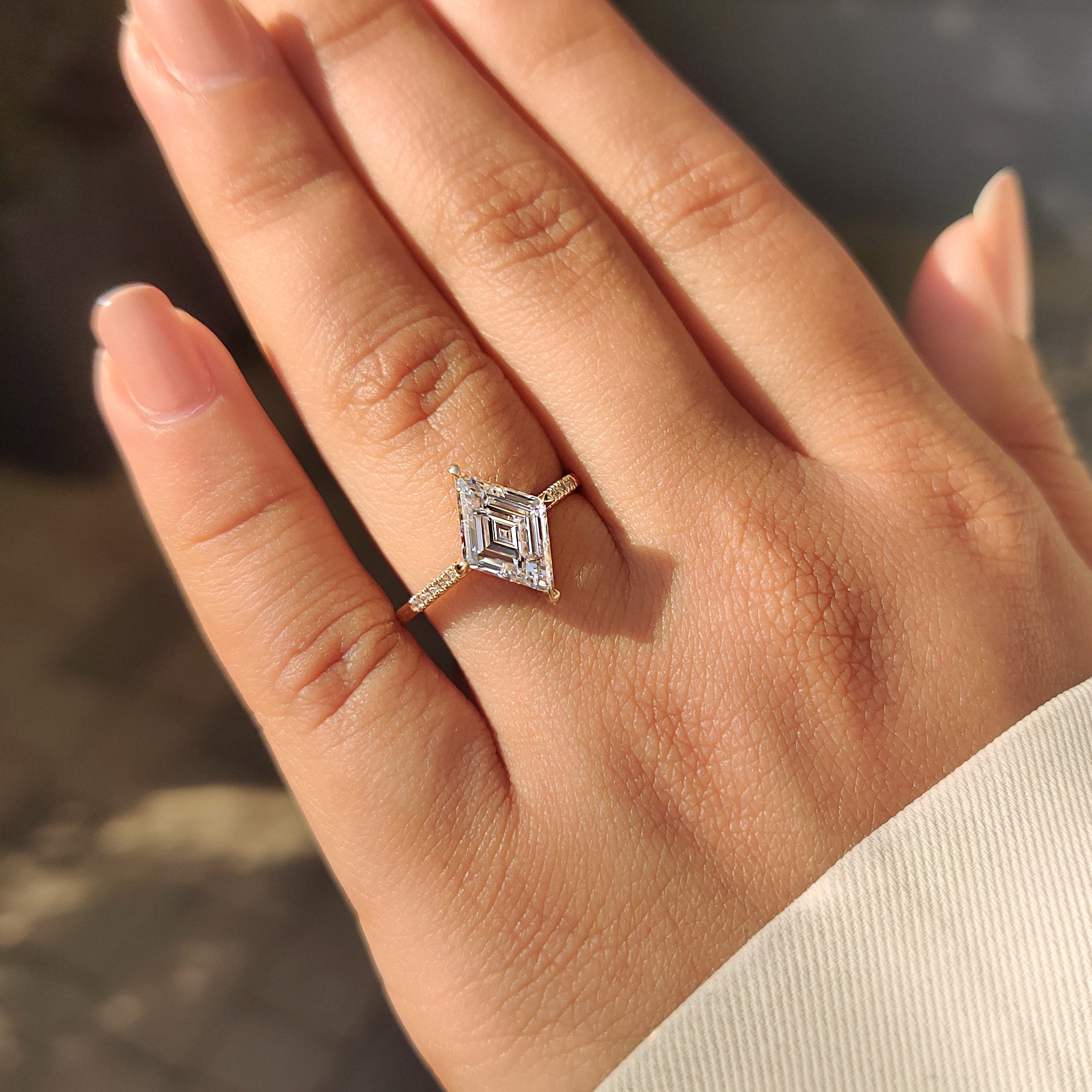 Handmade lozenge cut ring with compass prongs.
