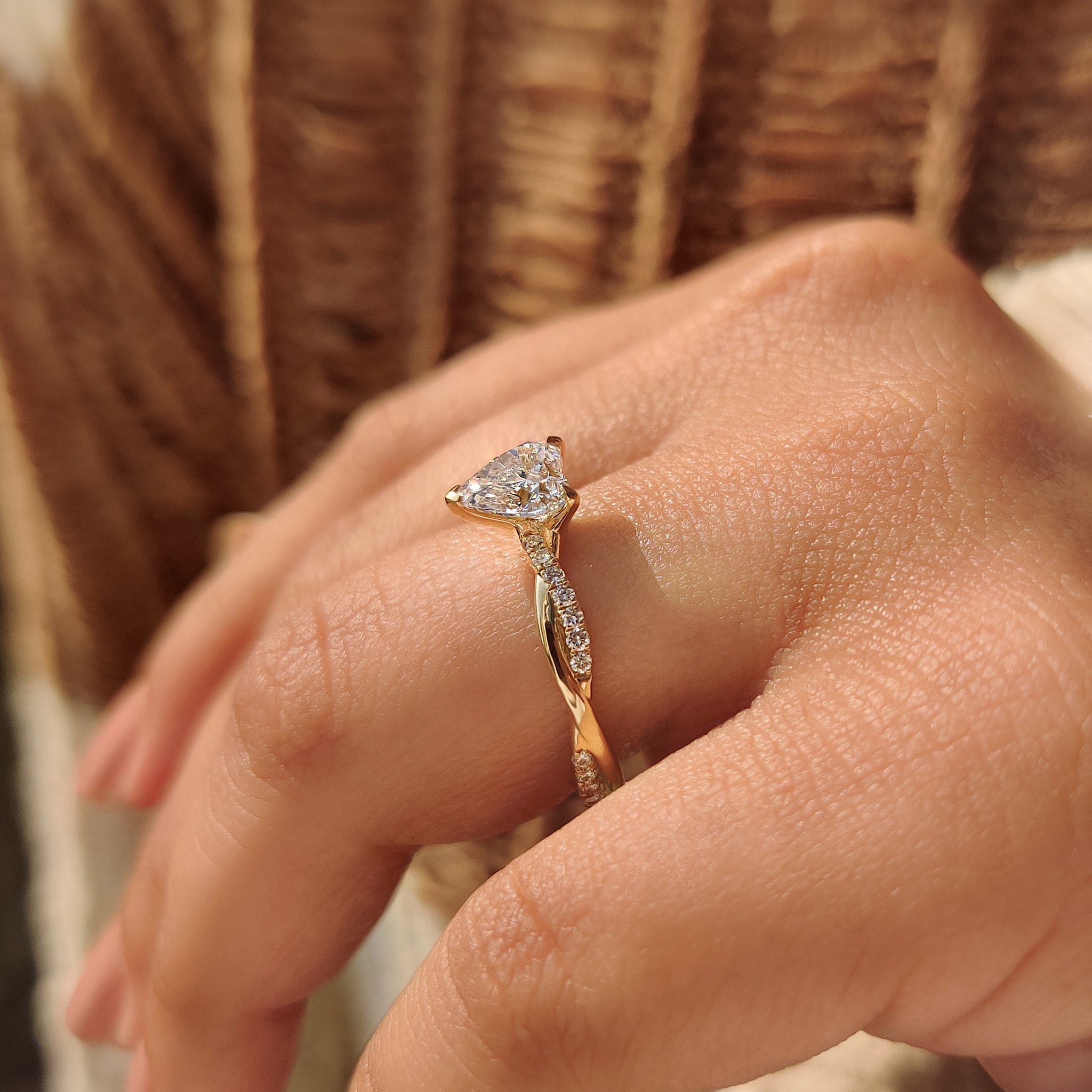 Custom diamond ring heart shaped diamond twisted engagement ring.
