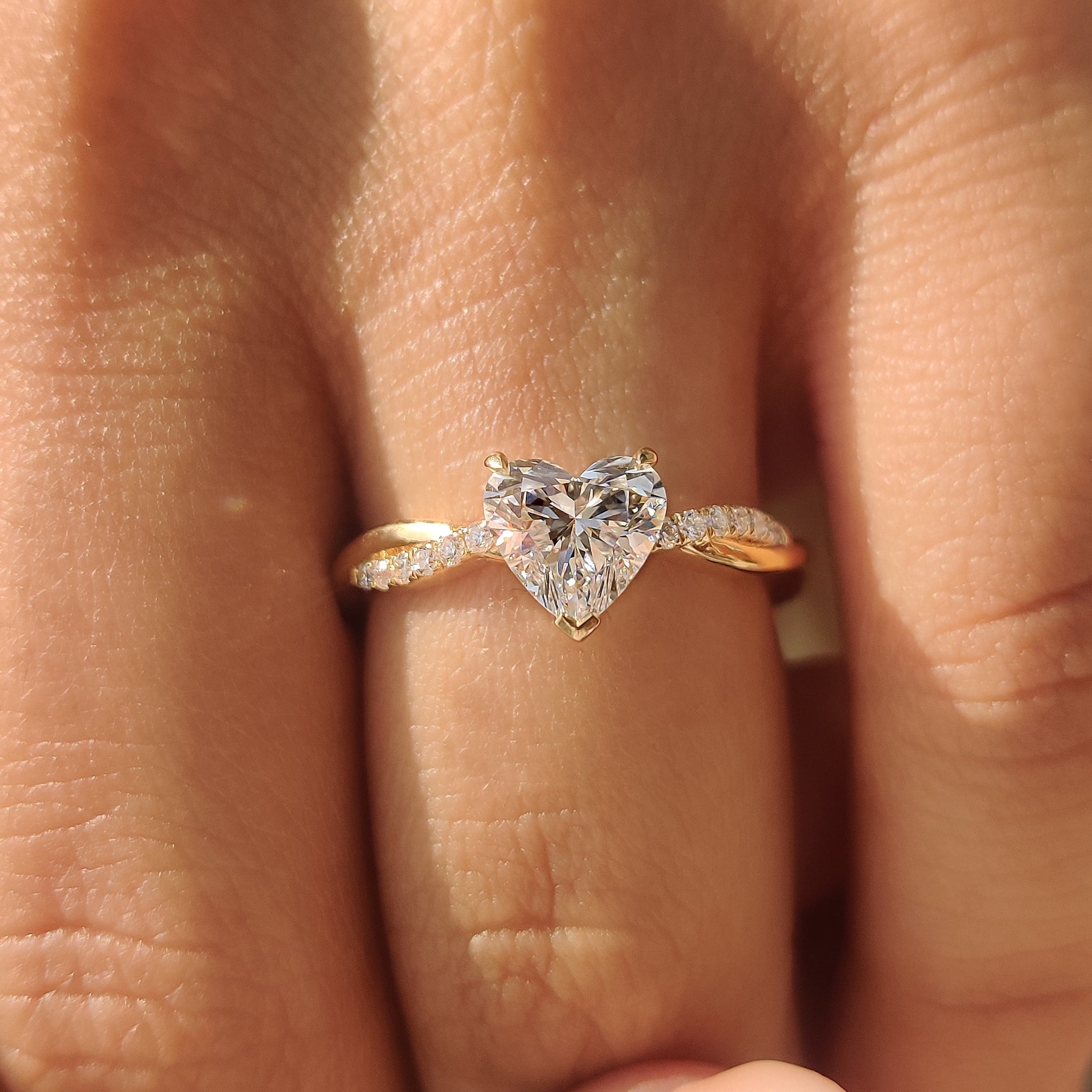 Buy engagement ring heart shaped diamond with twisted pave ring.
