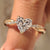 Heart shaped diamond ring with pave setting ring and twisted engagement ring.
