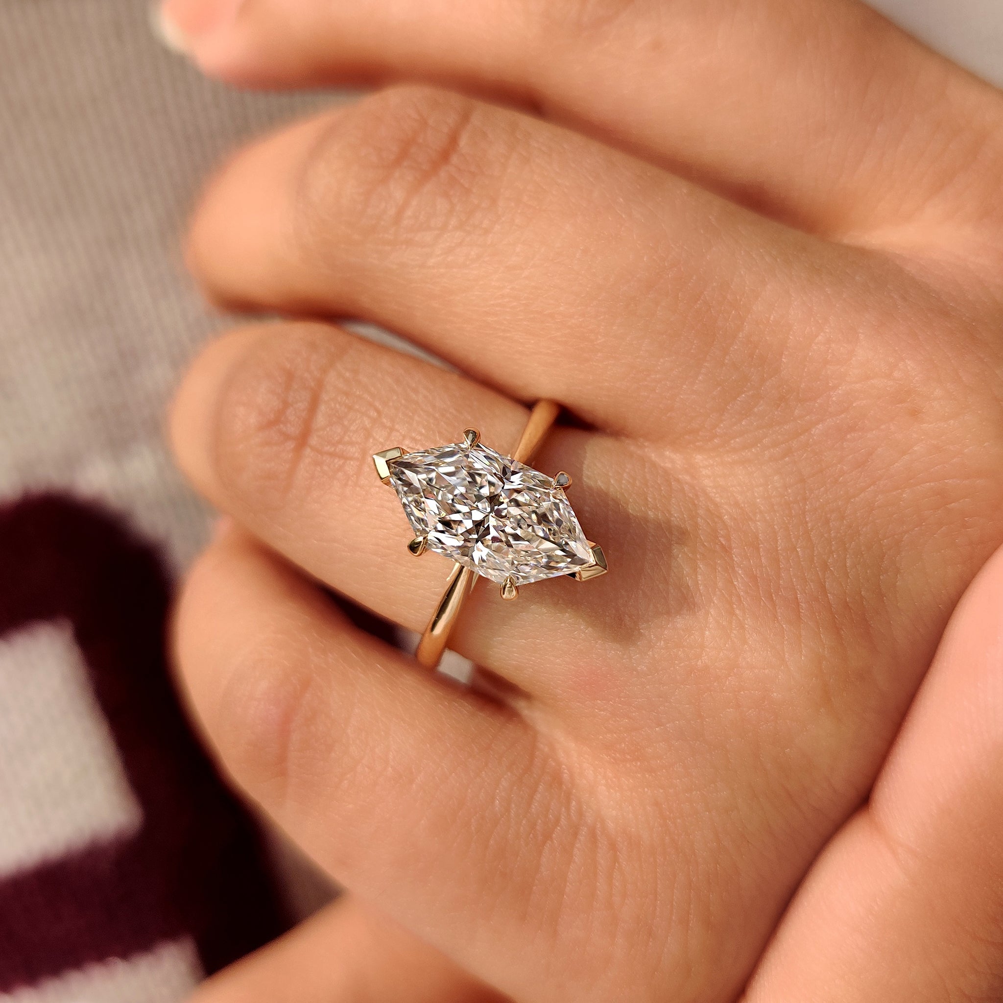 Round shape hidden halo ring with tapered shank design.
