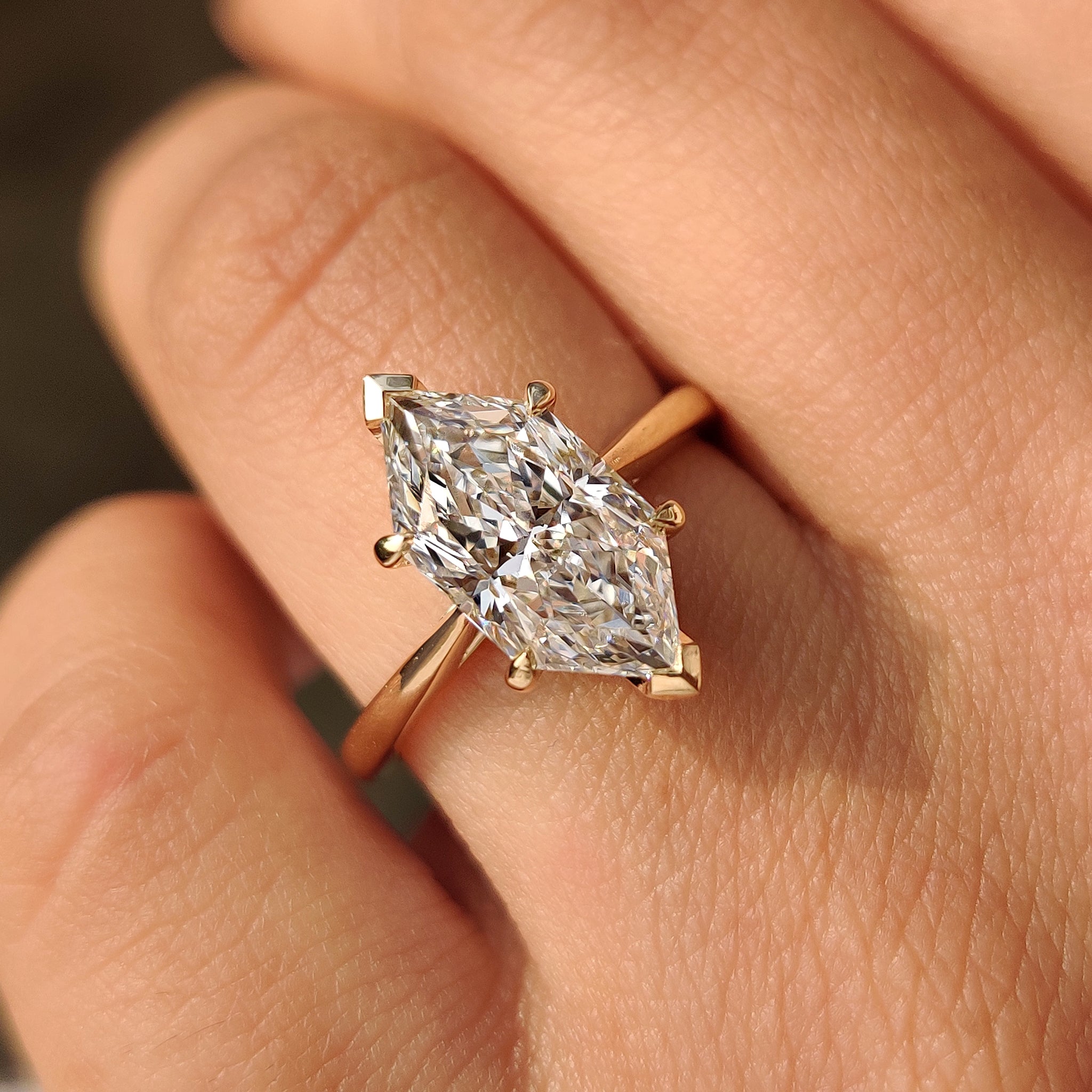 Dutch marquise ring featuring round shape hidden halo.

