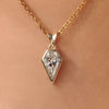 Spear cut moissanite solitaire pendant in bezel setting.
