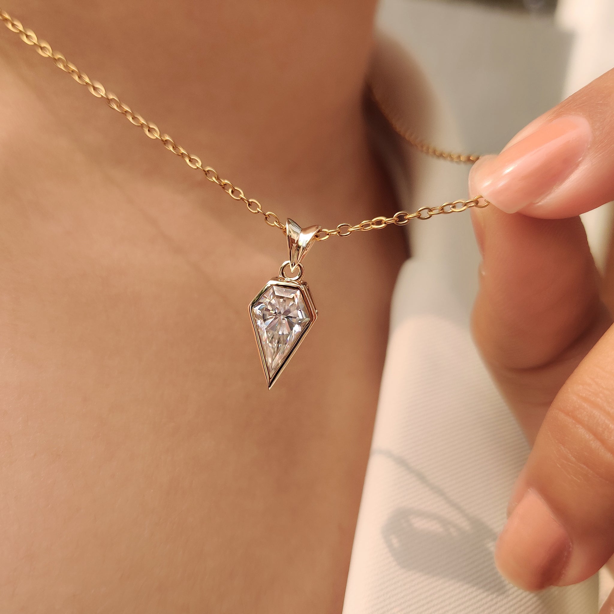 Handmade moissanite solitaire pendant spear cut.
