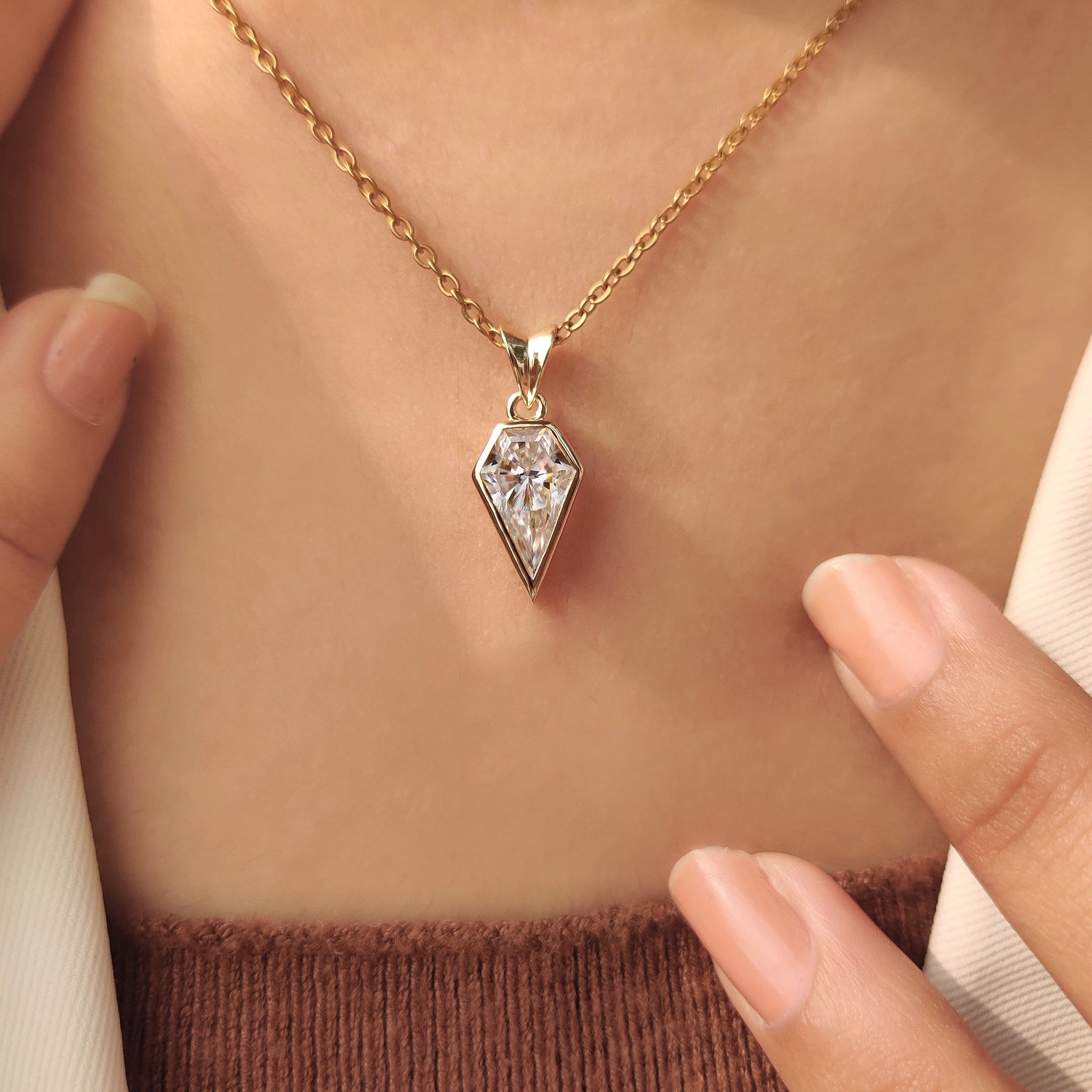 Spear cut moissanite pendant with clean bezel finish.