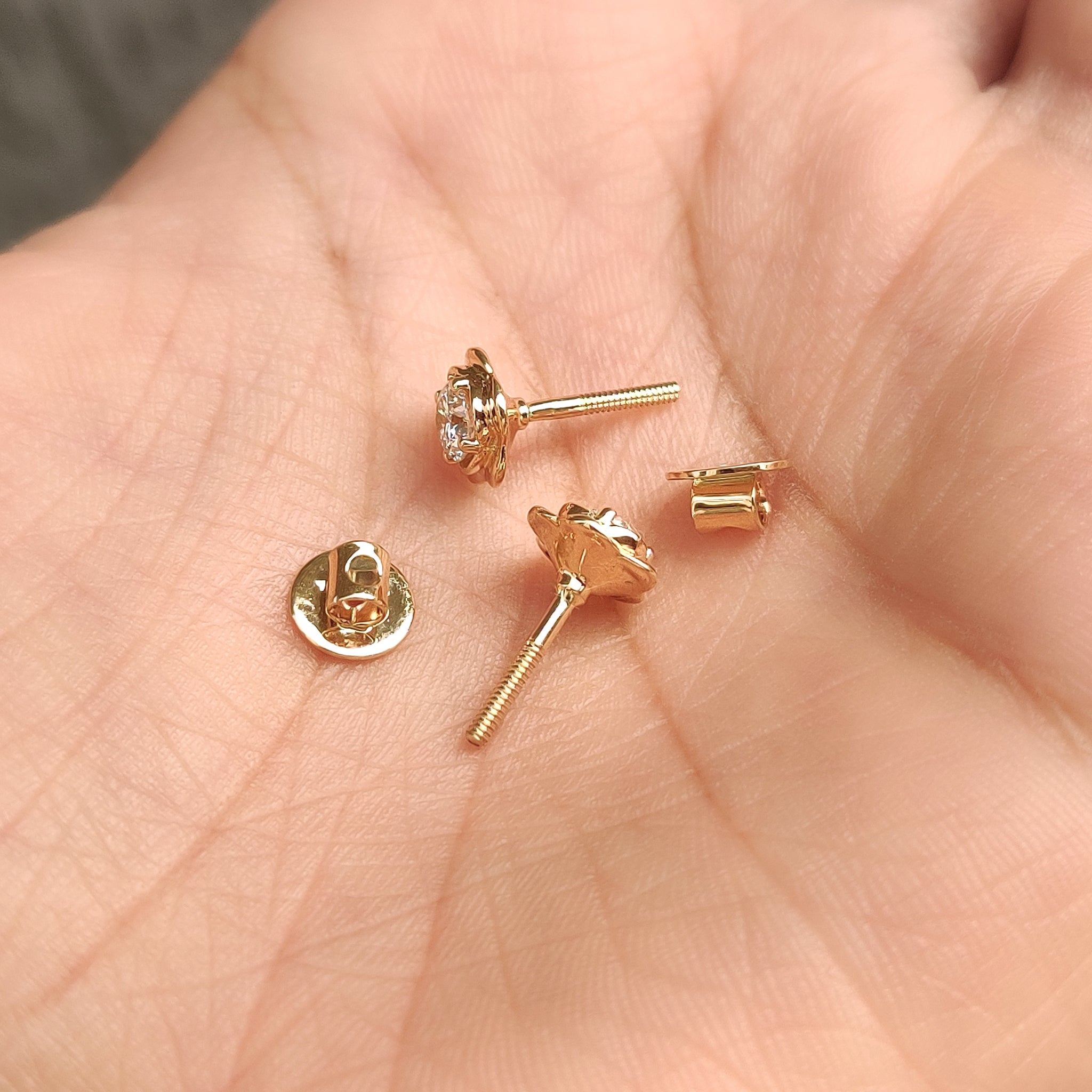 Carat Diamonds flower shaped diamond earrings.
