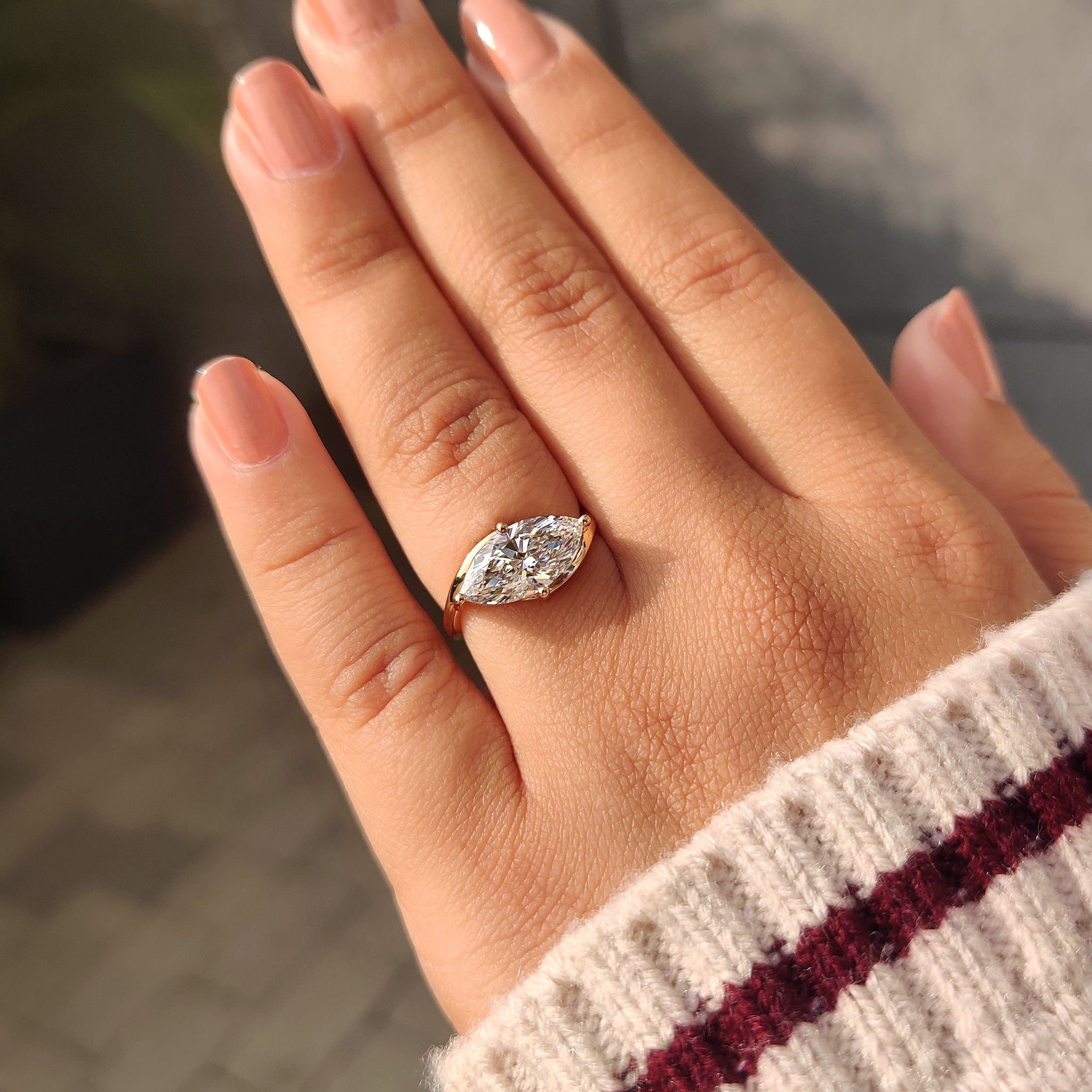 Handmade east to west setting marquise diamond solitaire ring IGI certified.
