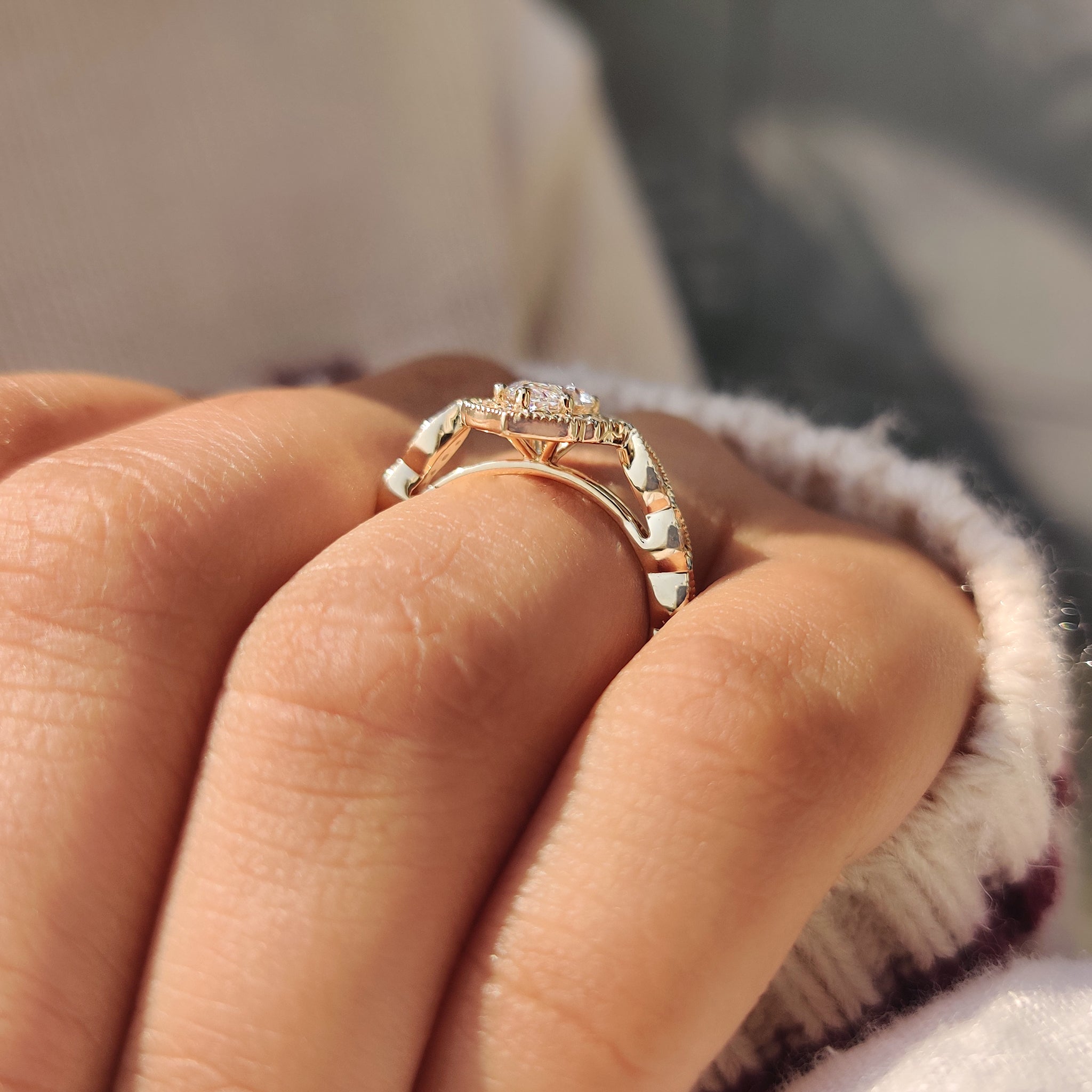 Cathedral style marquise diamond ring with round halo.
