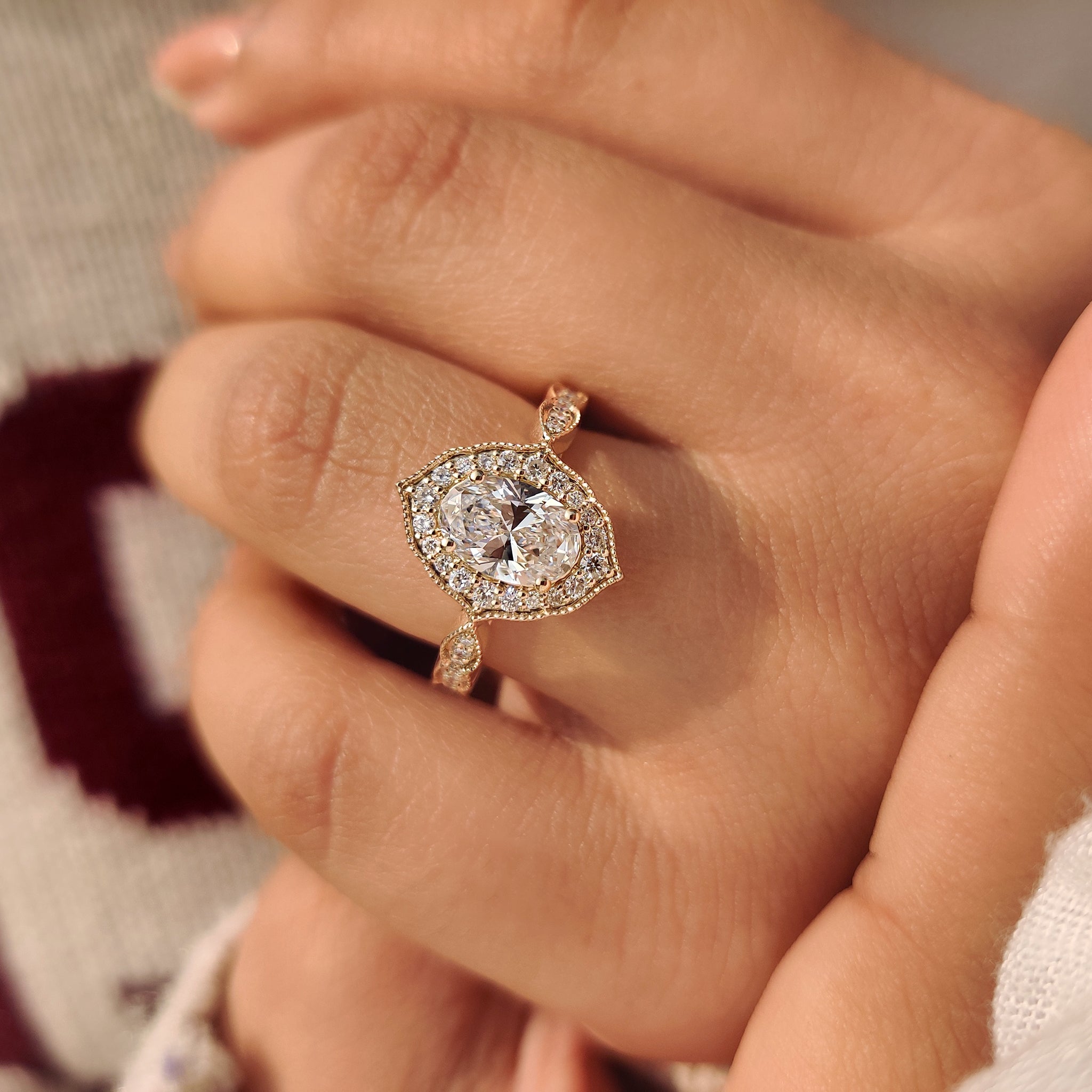 Cathedral style oval diamond ring with round halo.
