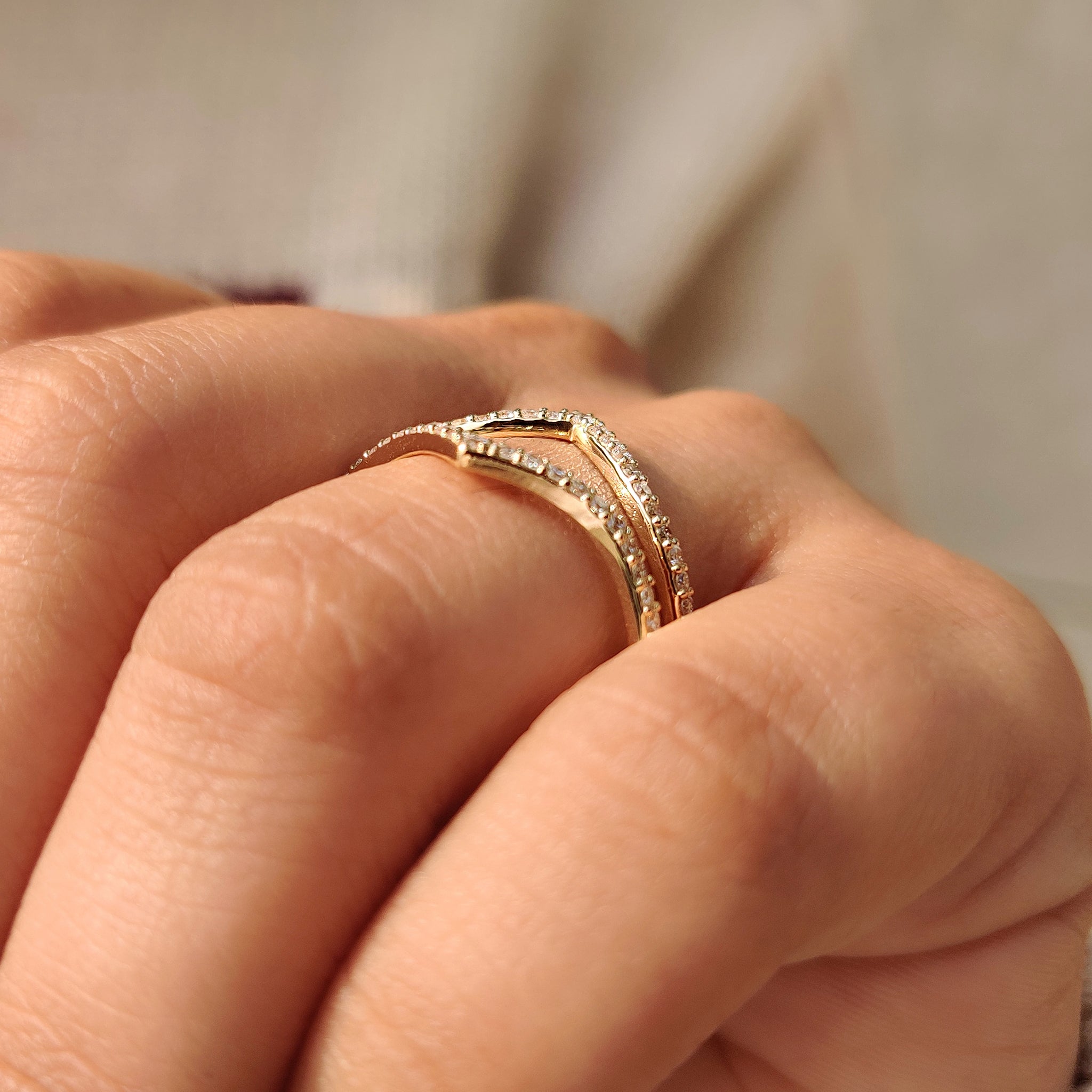 V shaped wrap guard band with half eternity diamonds.

