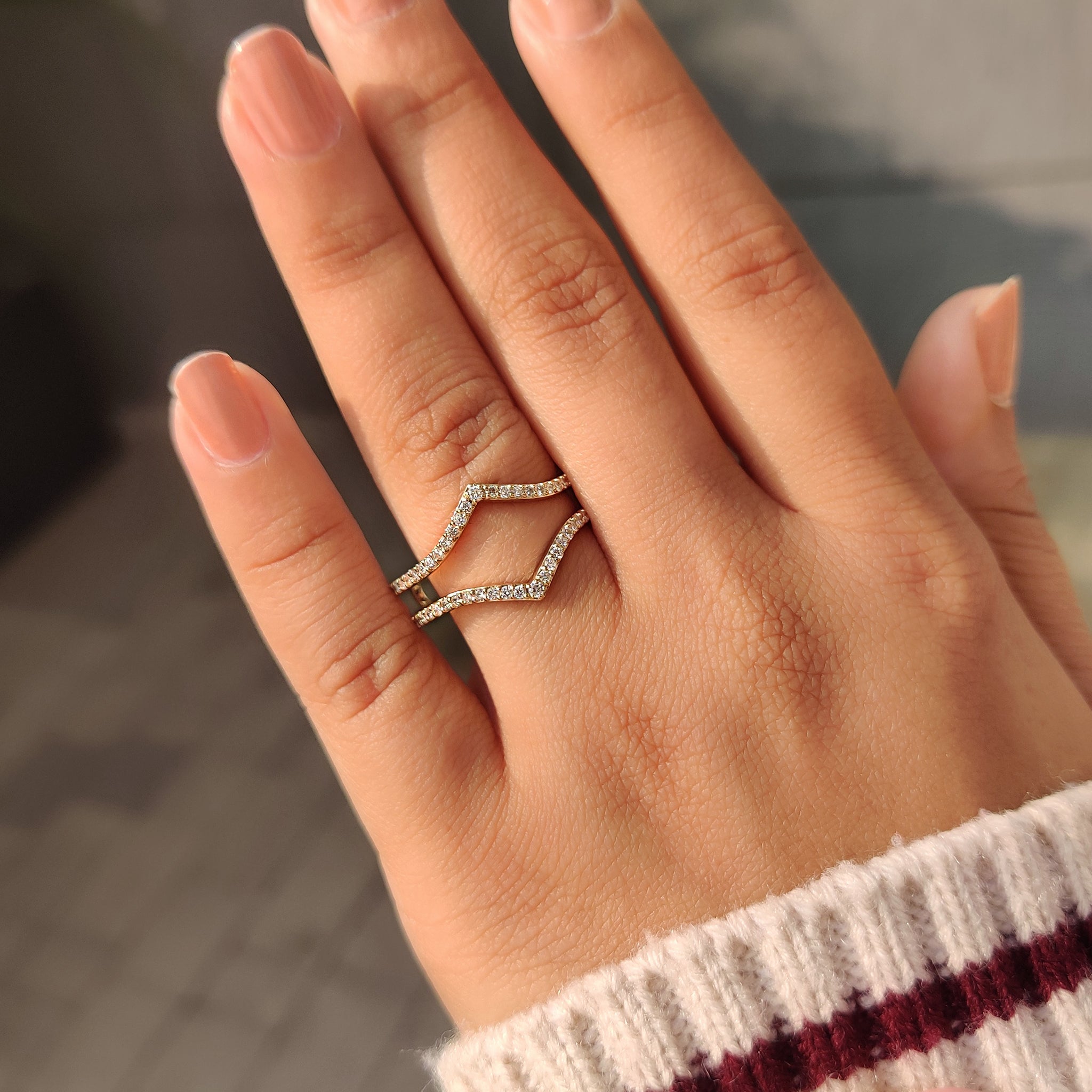 Handmade V shaped wedding band with round diamonds.
