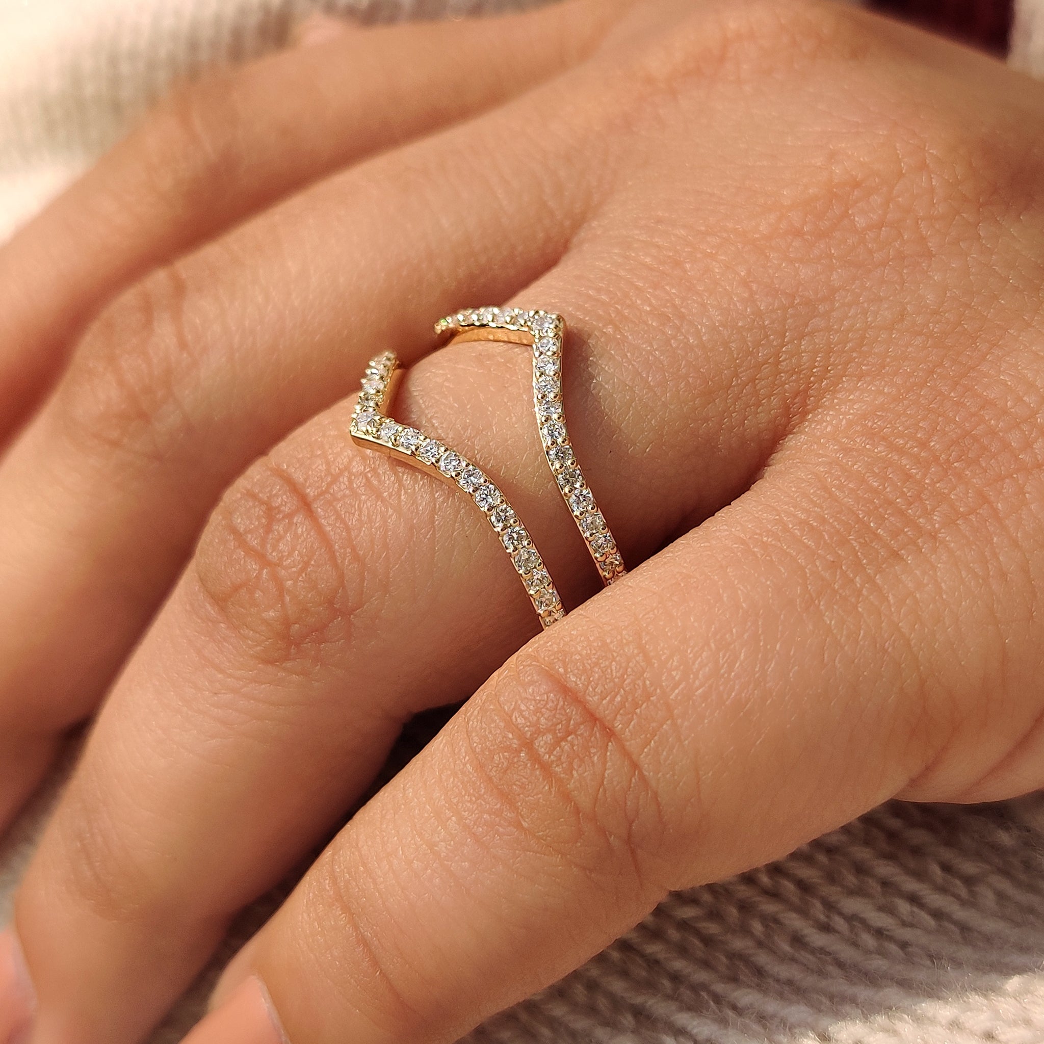 V shaped wedding band in half eternity style.
