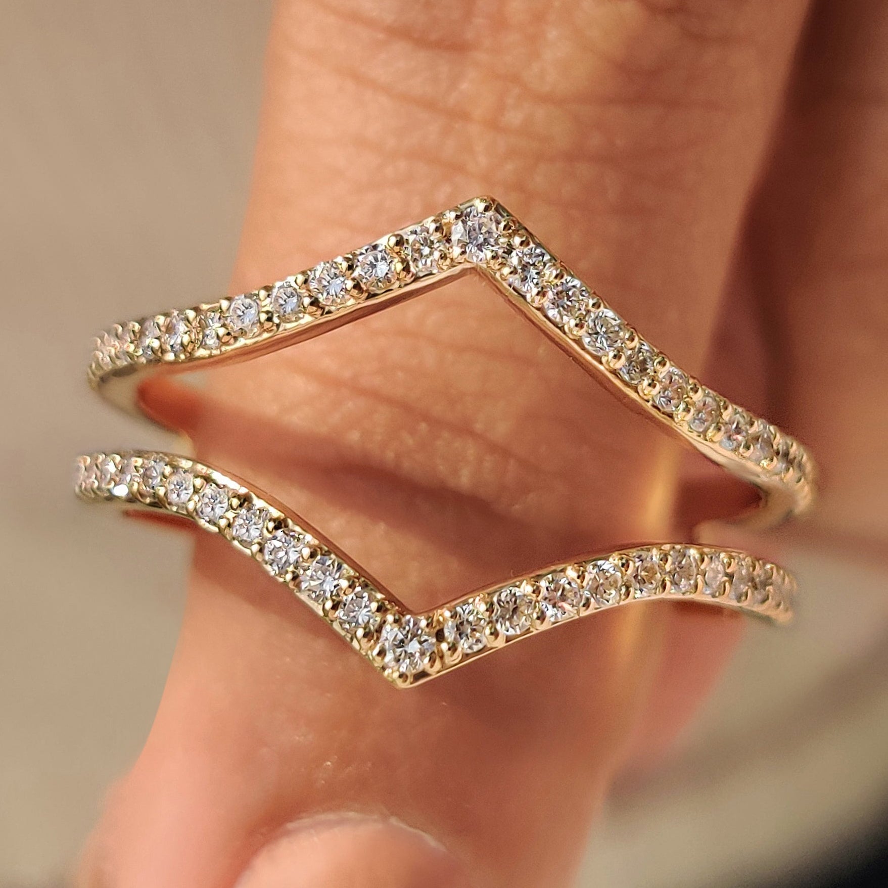 V shaped wedding band with round lab grown diamonds.
