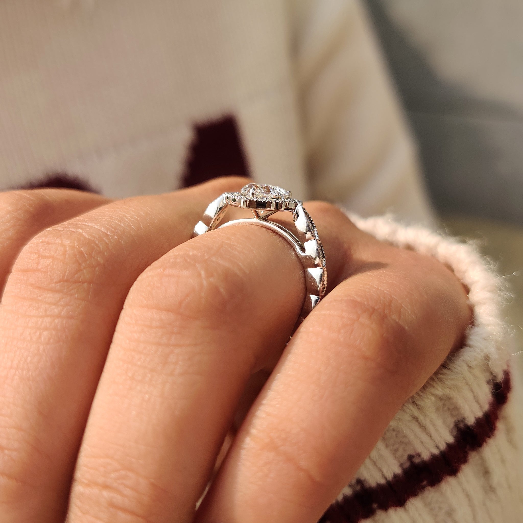 Vintage style heart cut diamond ring with halo.
