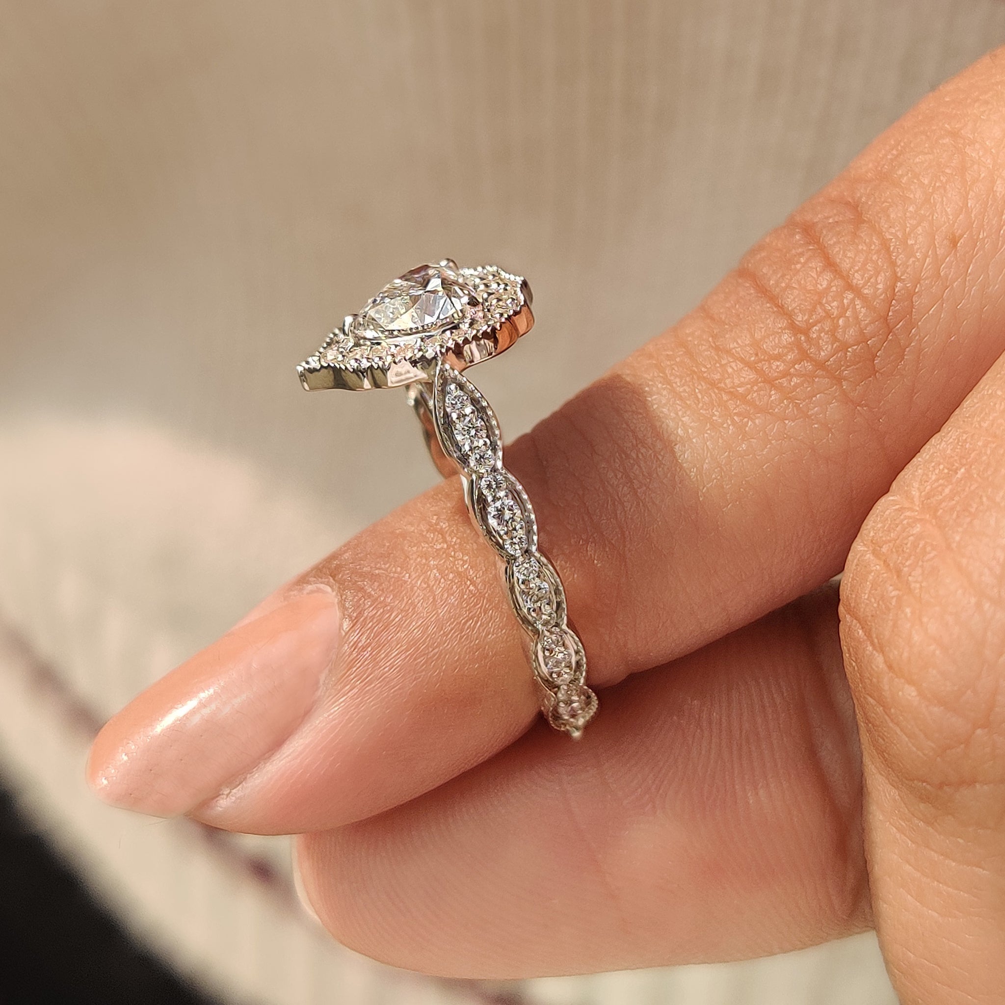 Handmade heart cut diamond ring with milgrain detail.
