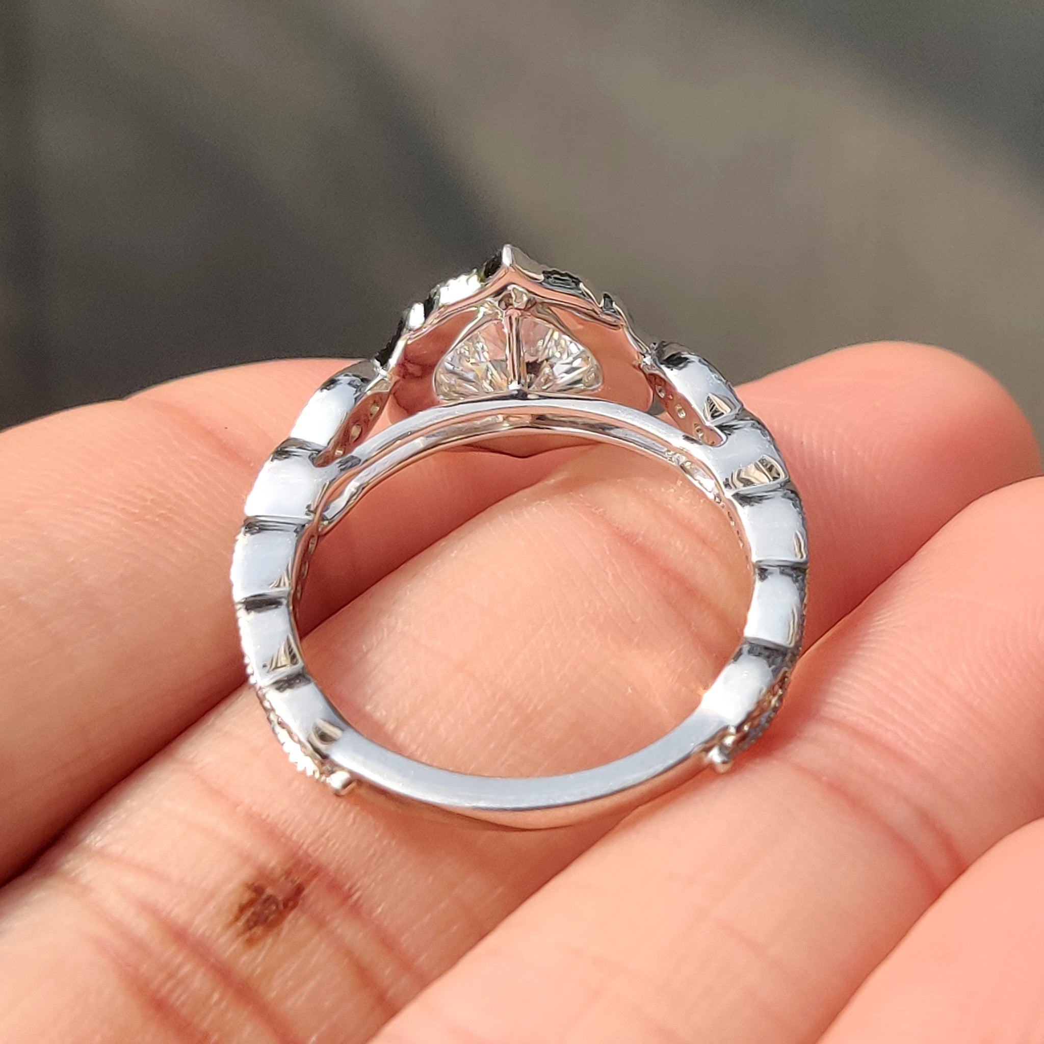 Lab grown heart cut diamond ring with cathedral setting.
