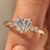 Heart cut diamond ring with round side stones.
