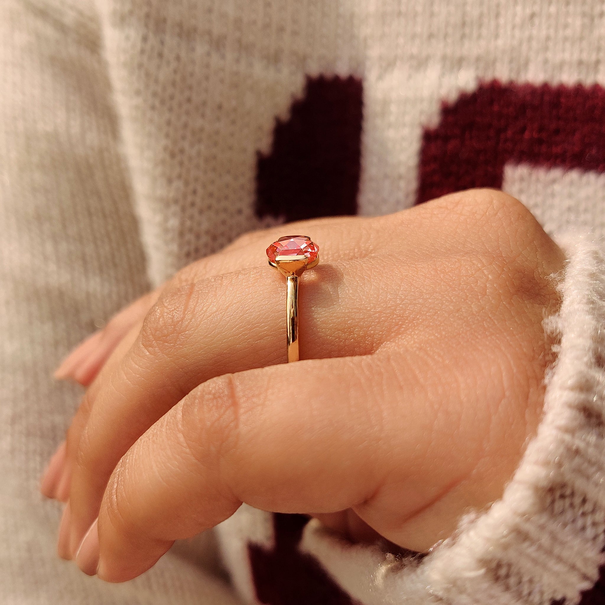 Rose cut pink diamond ring with open gallery design.
