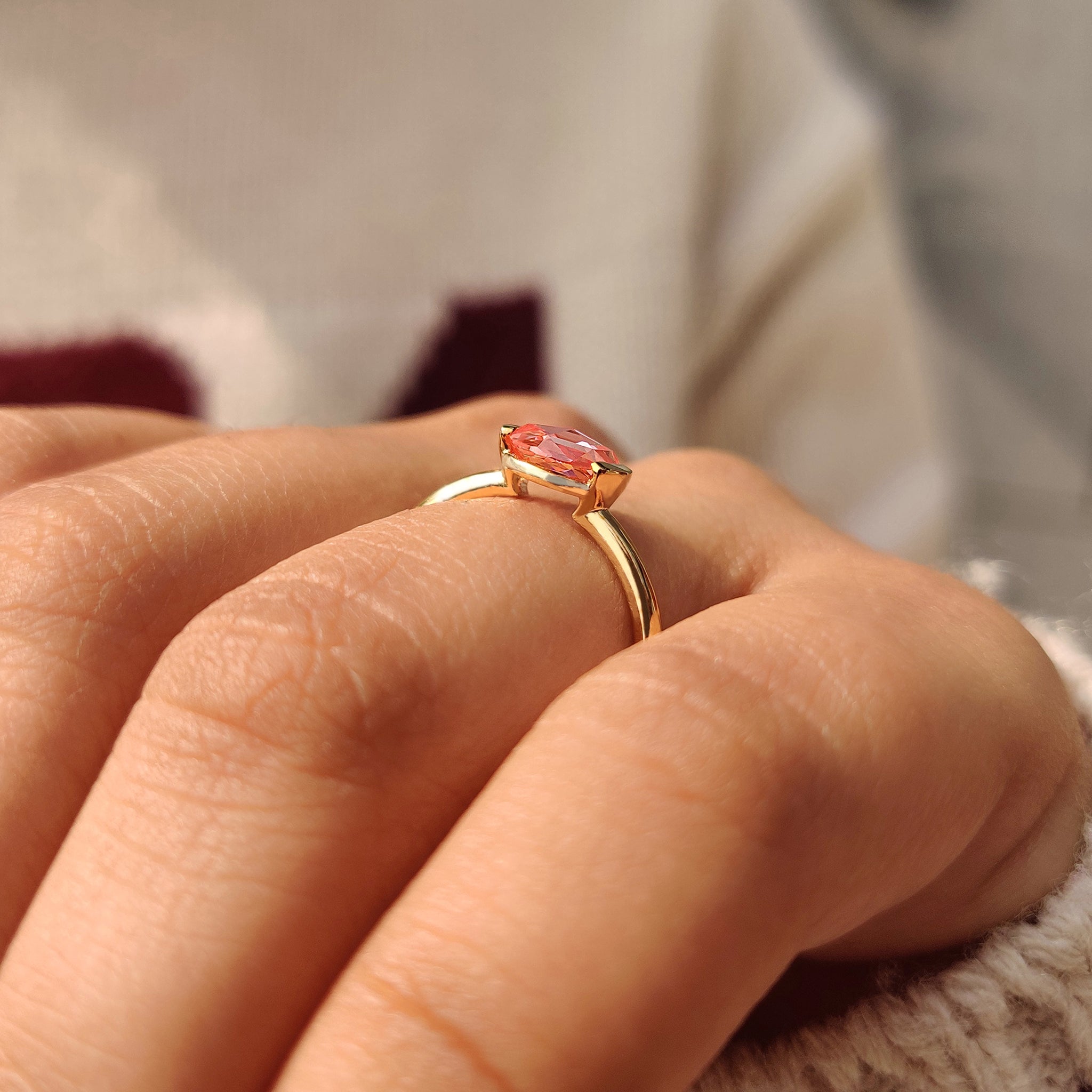 Pink diamond solitaire ring with semi bezel setting.
