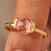 Solitaire engagement ring with round rose cut pink diamond.
