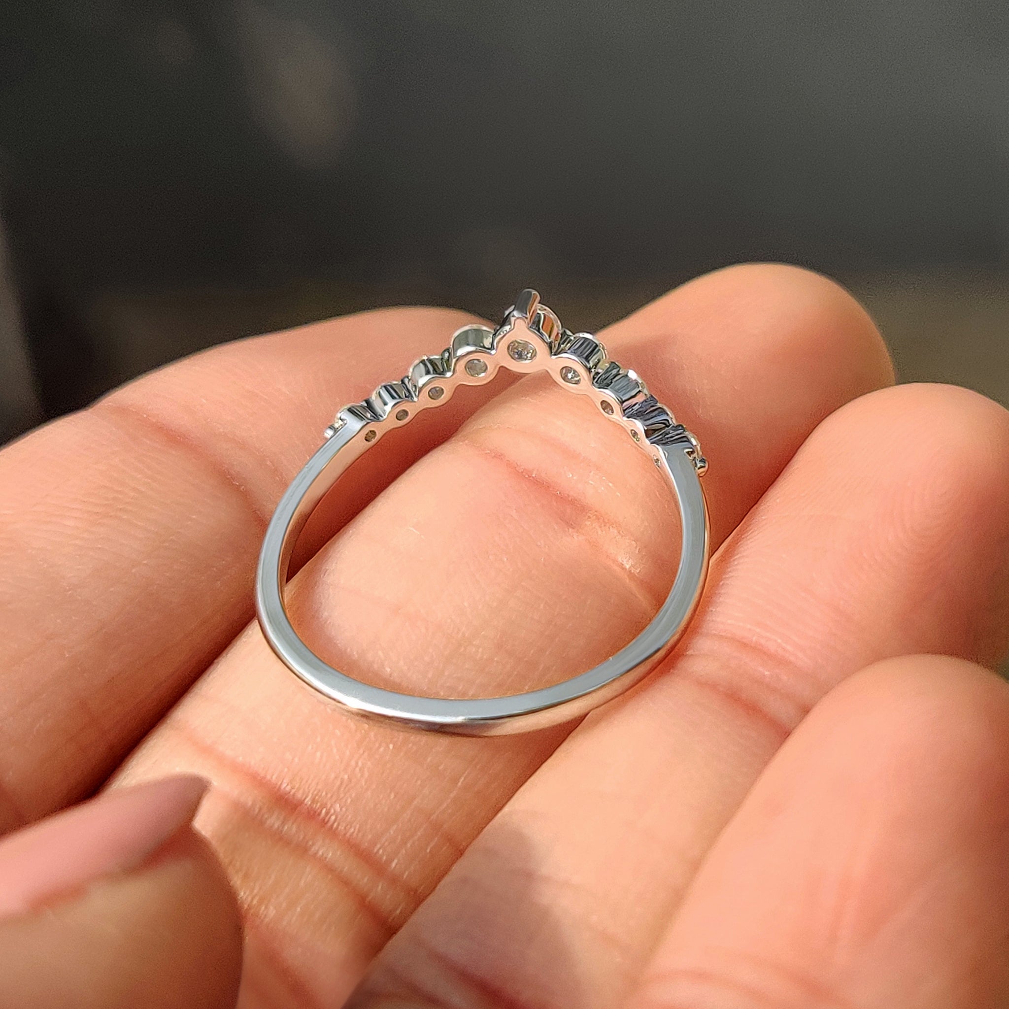 Carat Diamonds curved diamond wedding band handmade.
