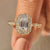 Emerald cut diamond ring with vintage halo design.