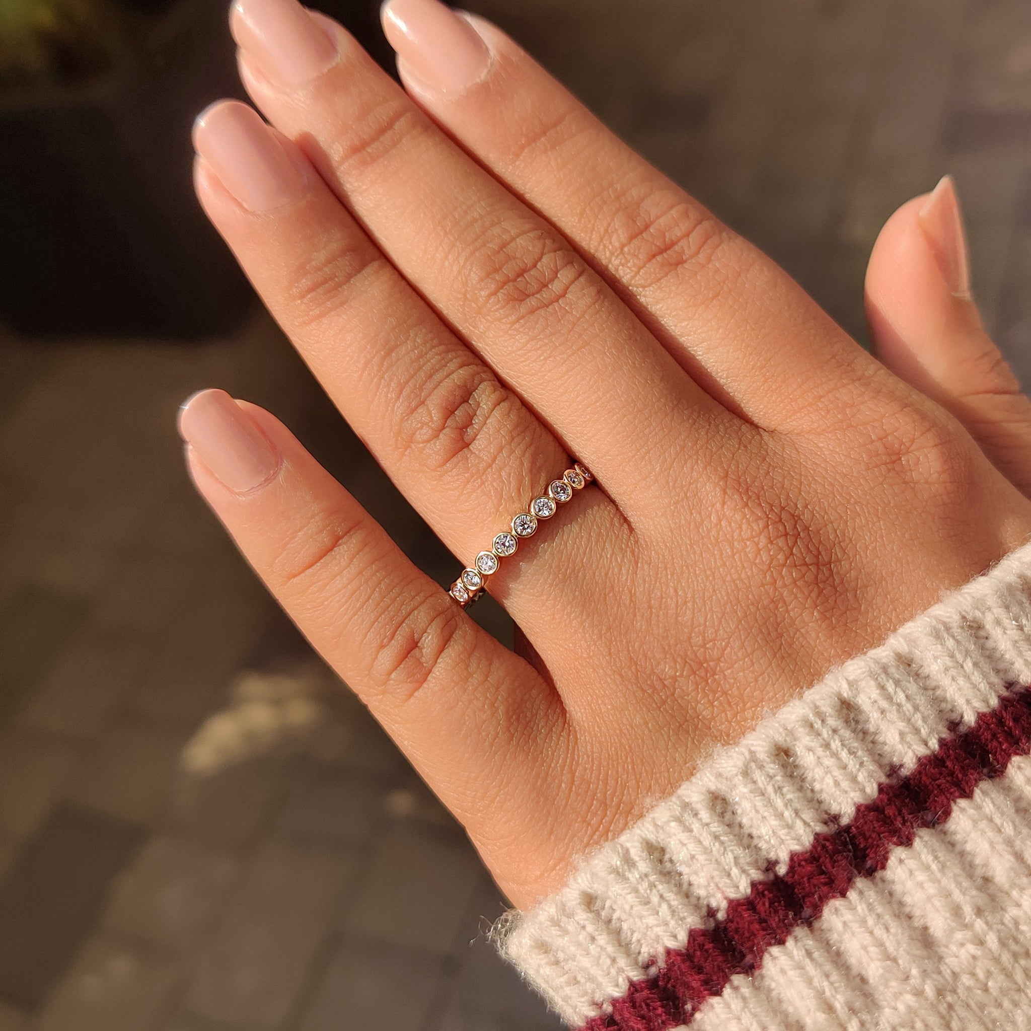 Bezel set round diamond wedding band full eternity.
