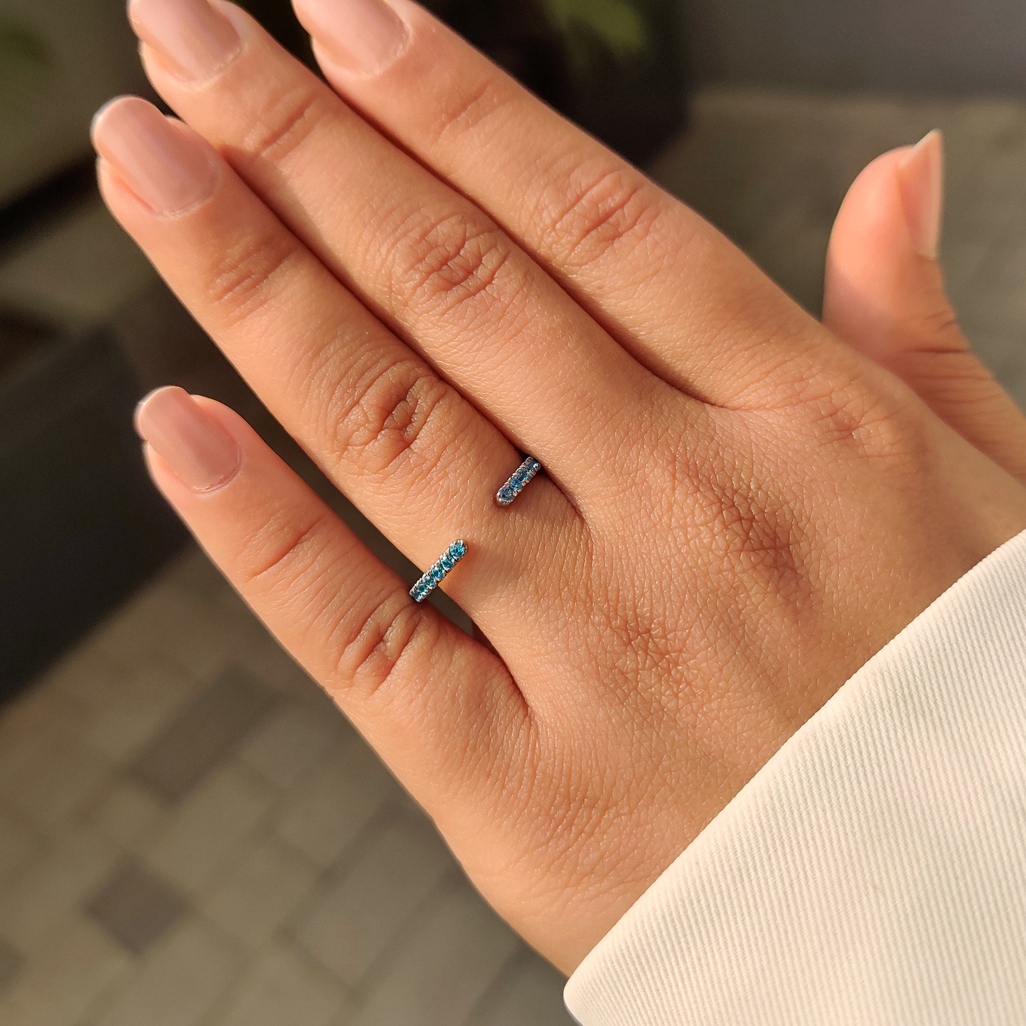 Handmade blue diamond wedding band by Carat Diamonds.
