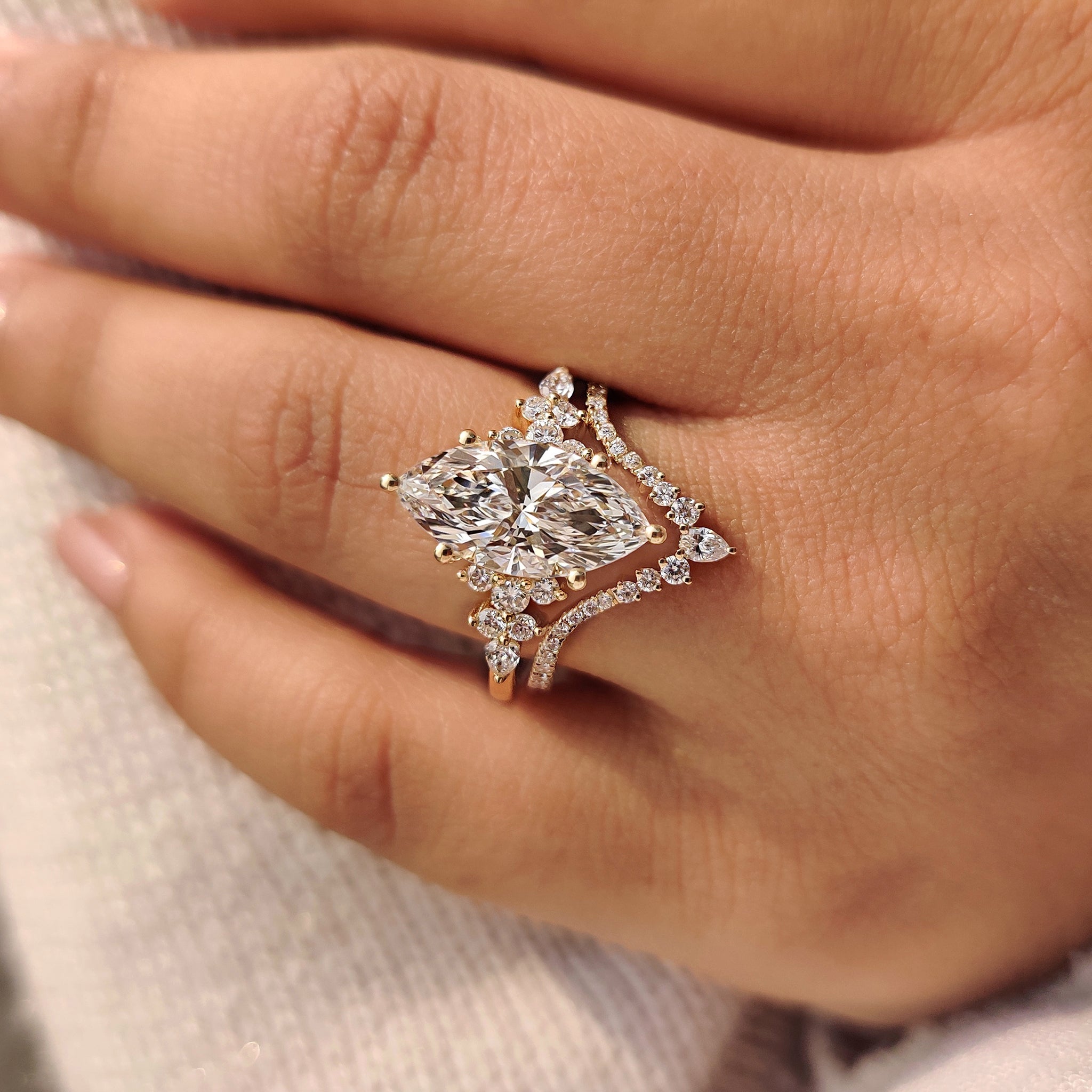 Handmade marquise bridal set with pear and round diamonds.
