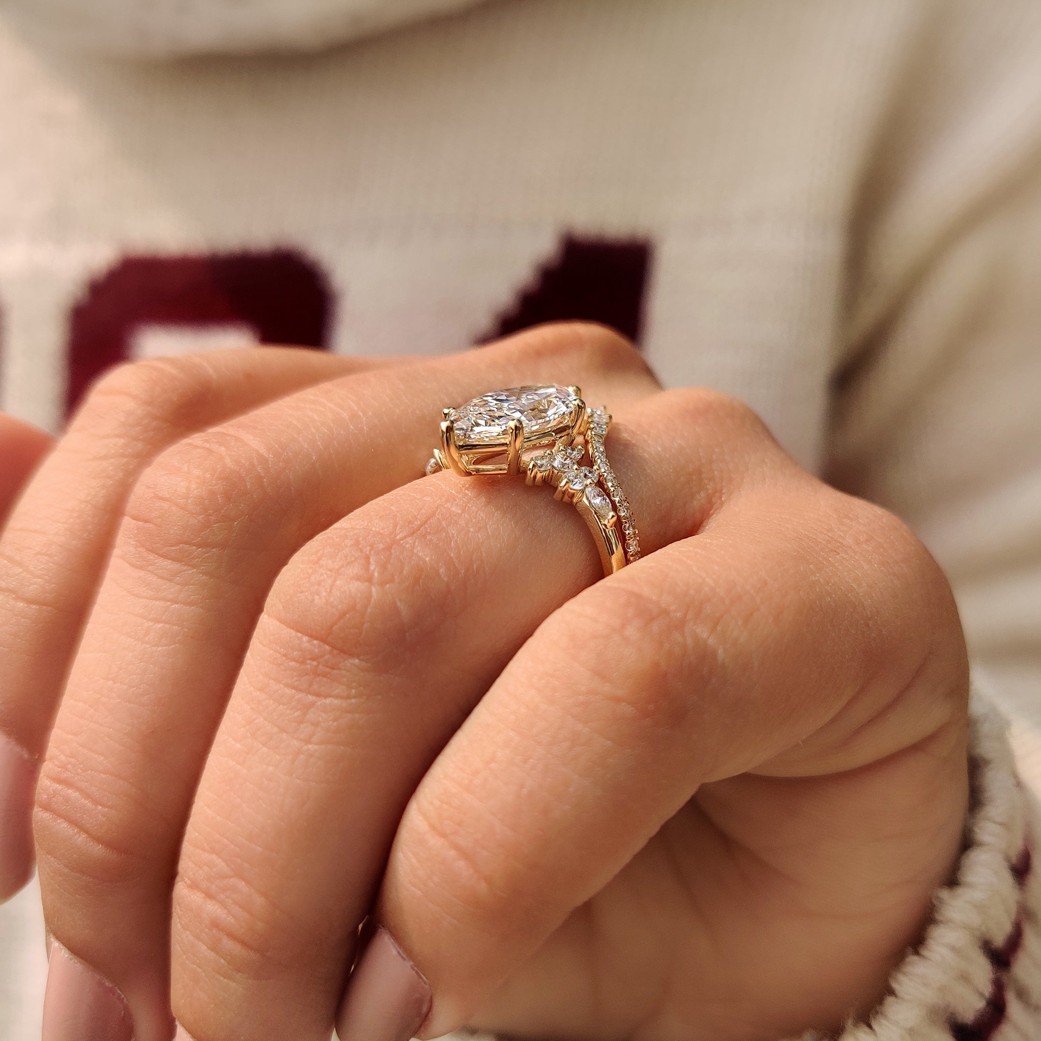 Chevron style wedding band with marquise engagement ring.
