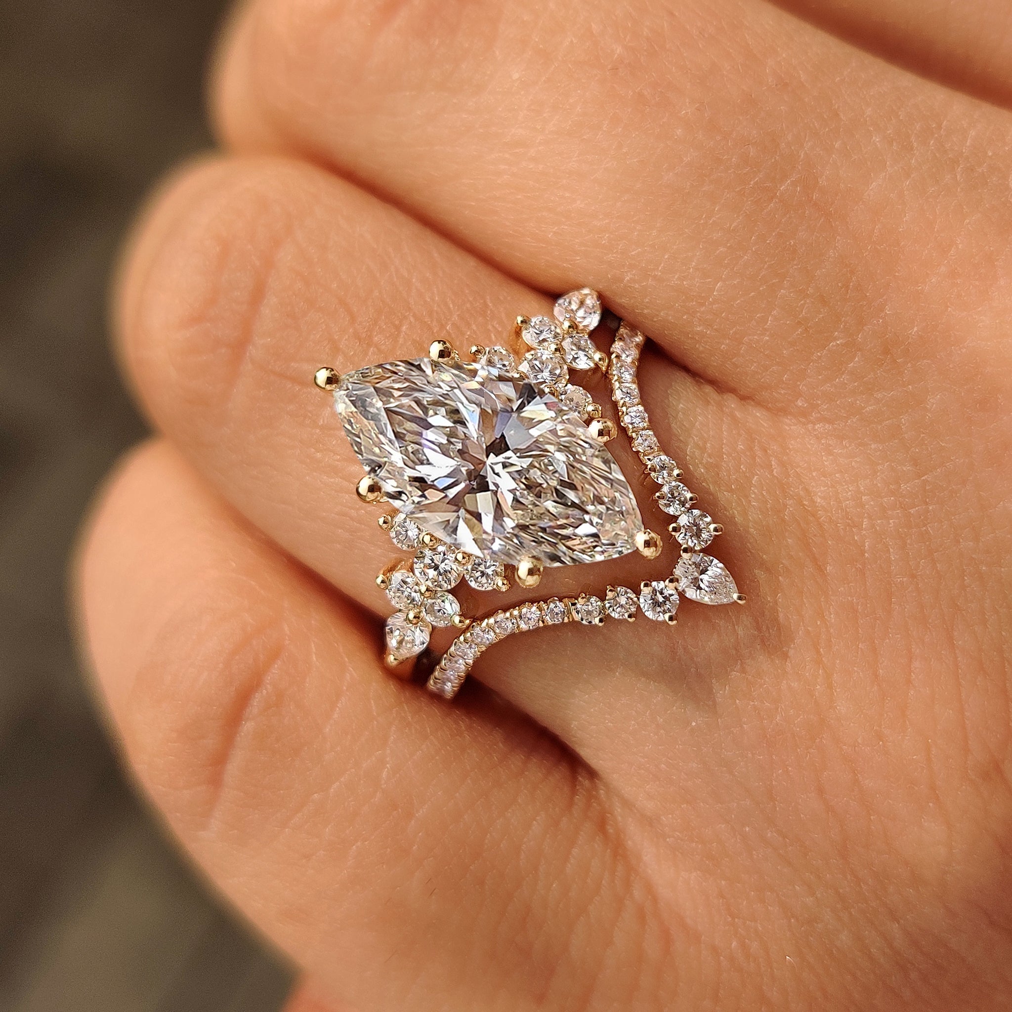Cluster setting marquise ring with v shaped wedding band.
