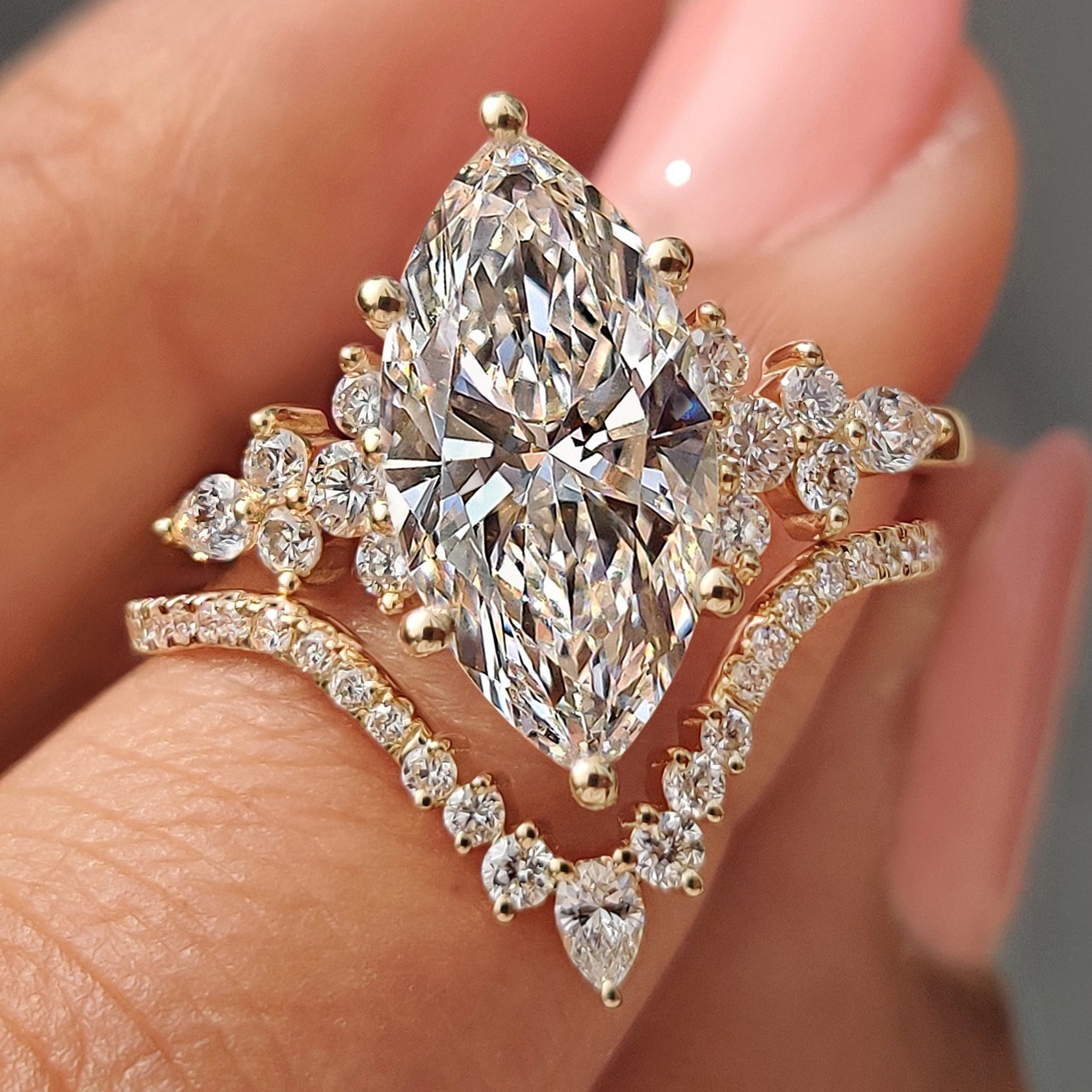 Marquise cut ring with wedding band in chevron bridal set.
