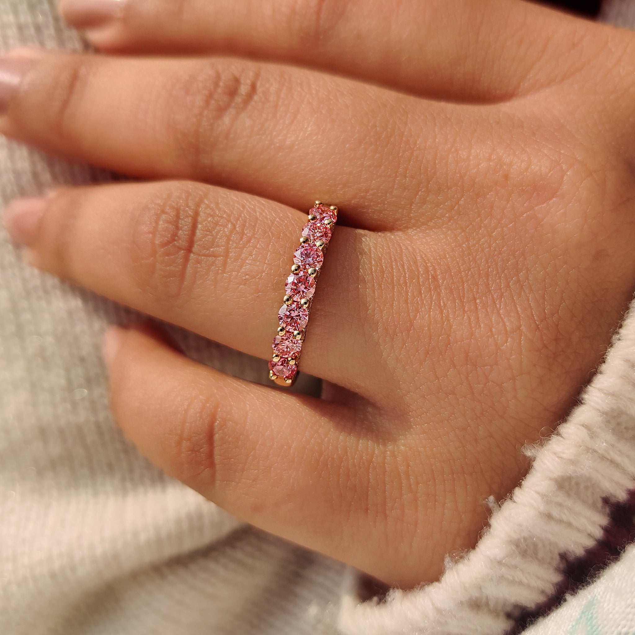 Handmade lab grown pink diamond wedding band.