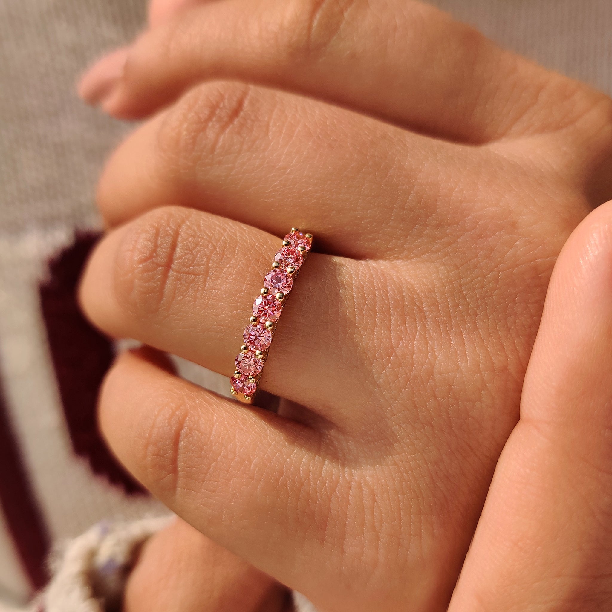Half eternity pink diamond wedding band lab grown.
