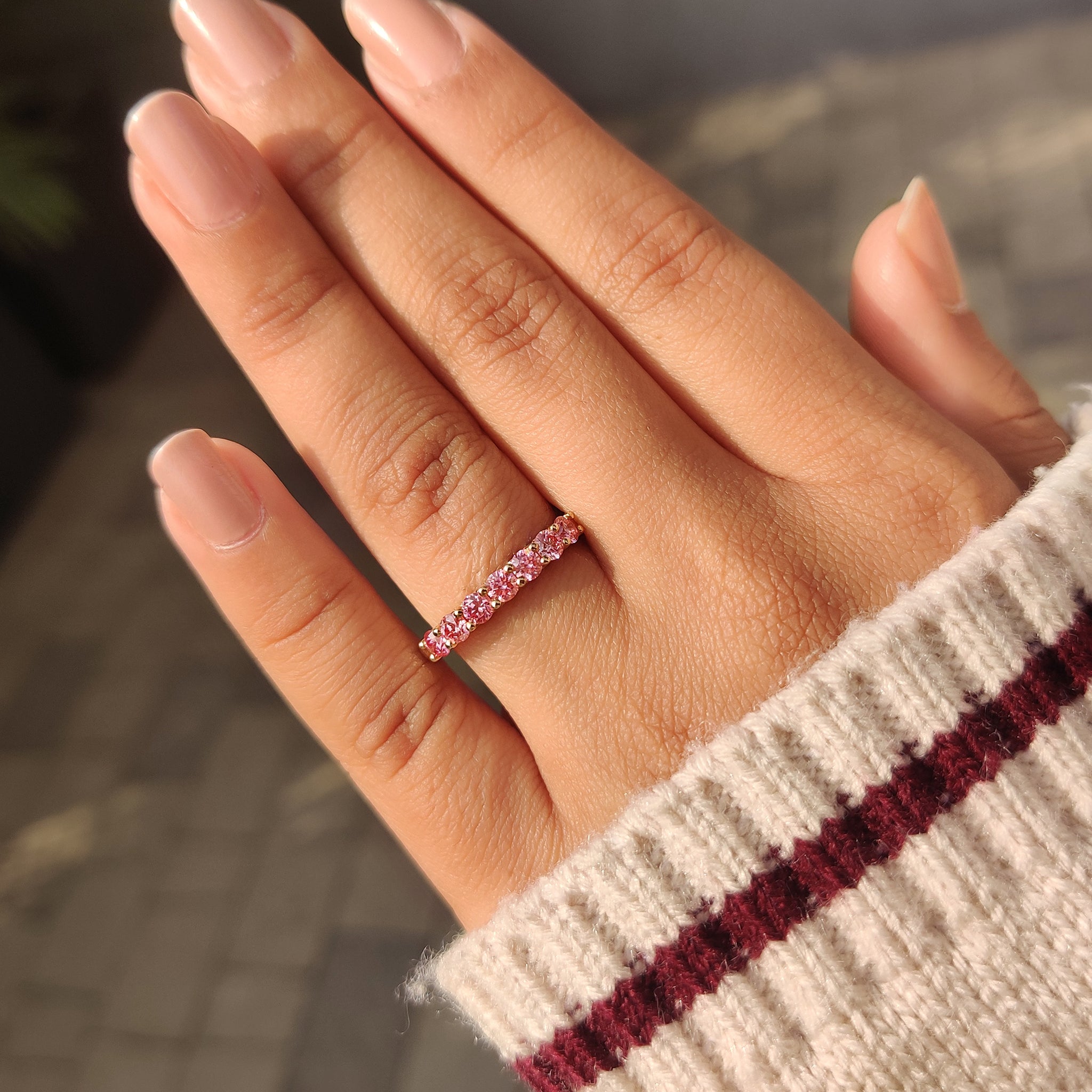 Carat Diamonds pink diamond wedding band half eternity.
