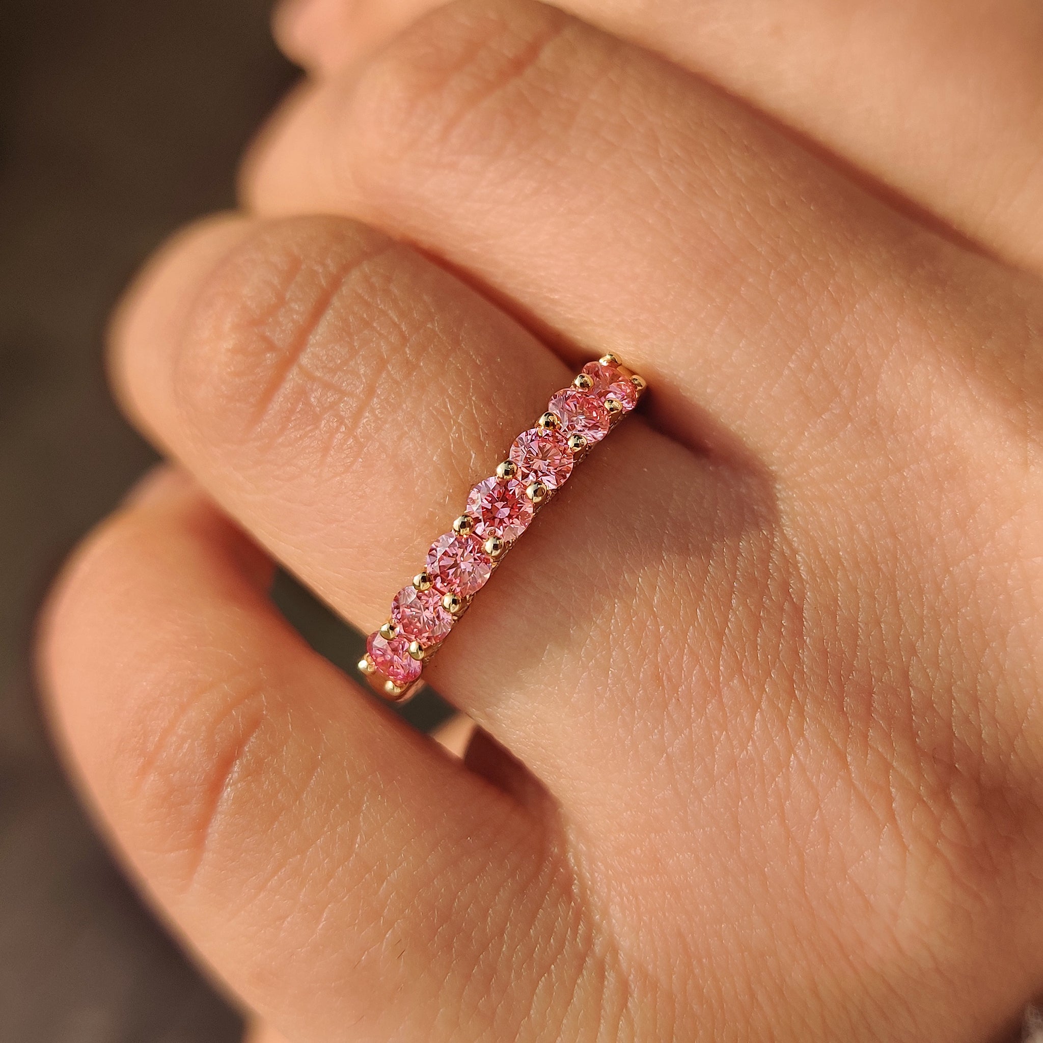 Half eternity round diamond band with tapered shank.
