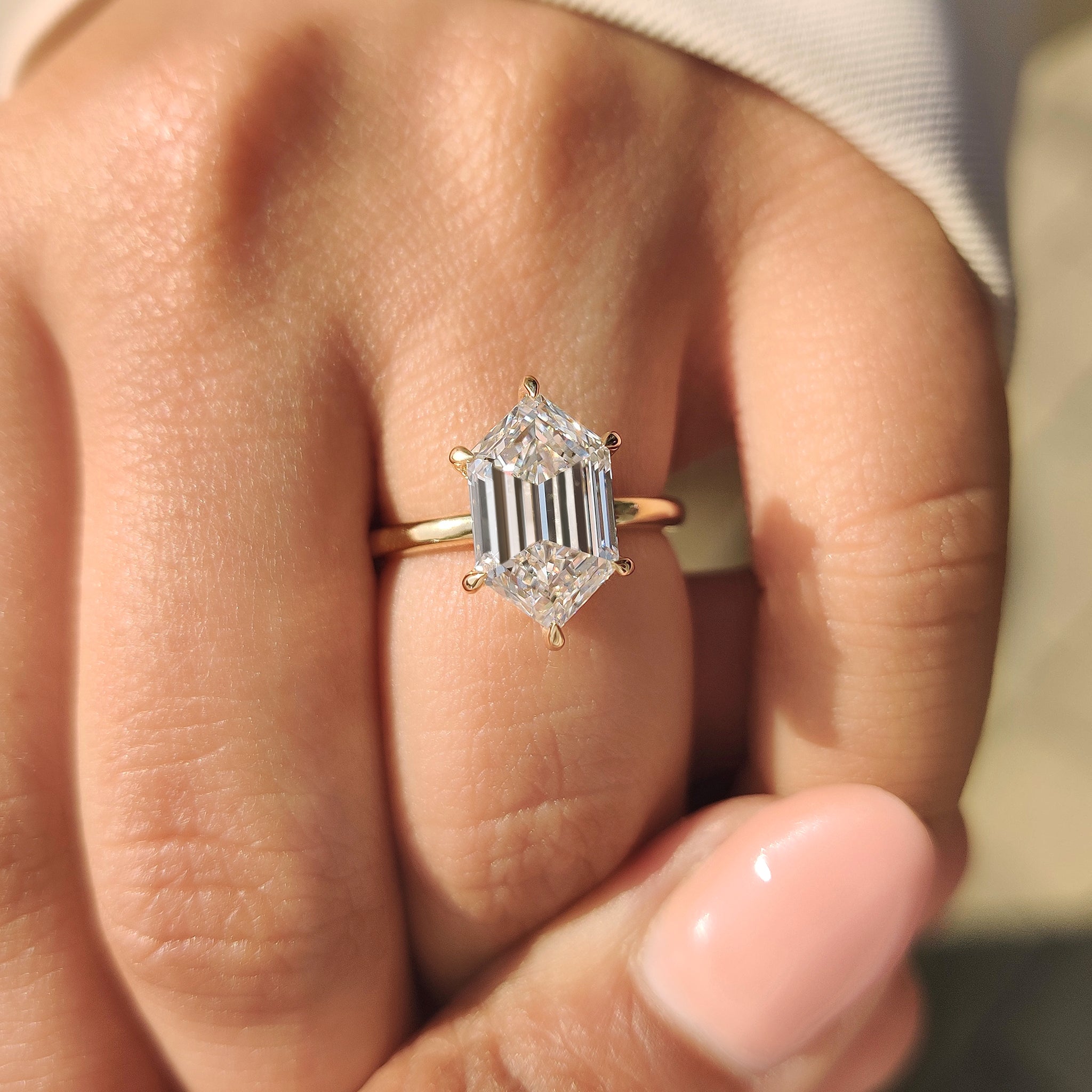 Solitaire diamond ring with clean hexagon shape center
