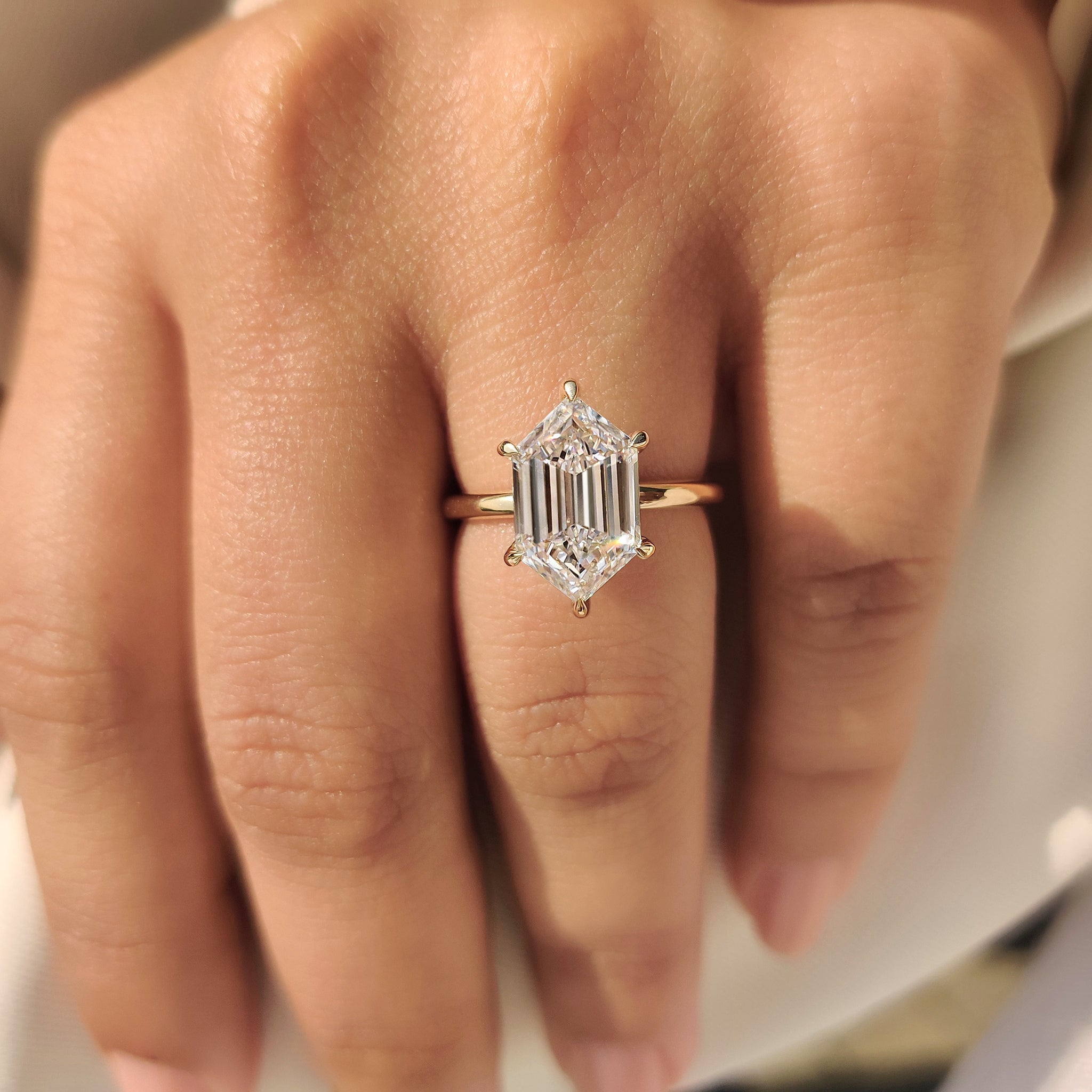 Solitaire diamond ring with secure six claw prong detail
