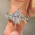 Dutch marquise diamond ring with green emerald gemstone accents
