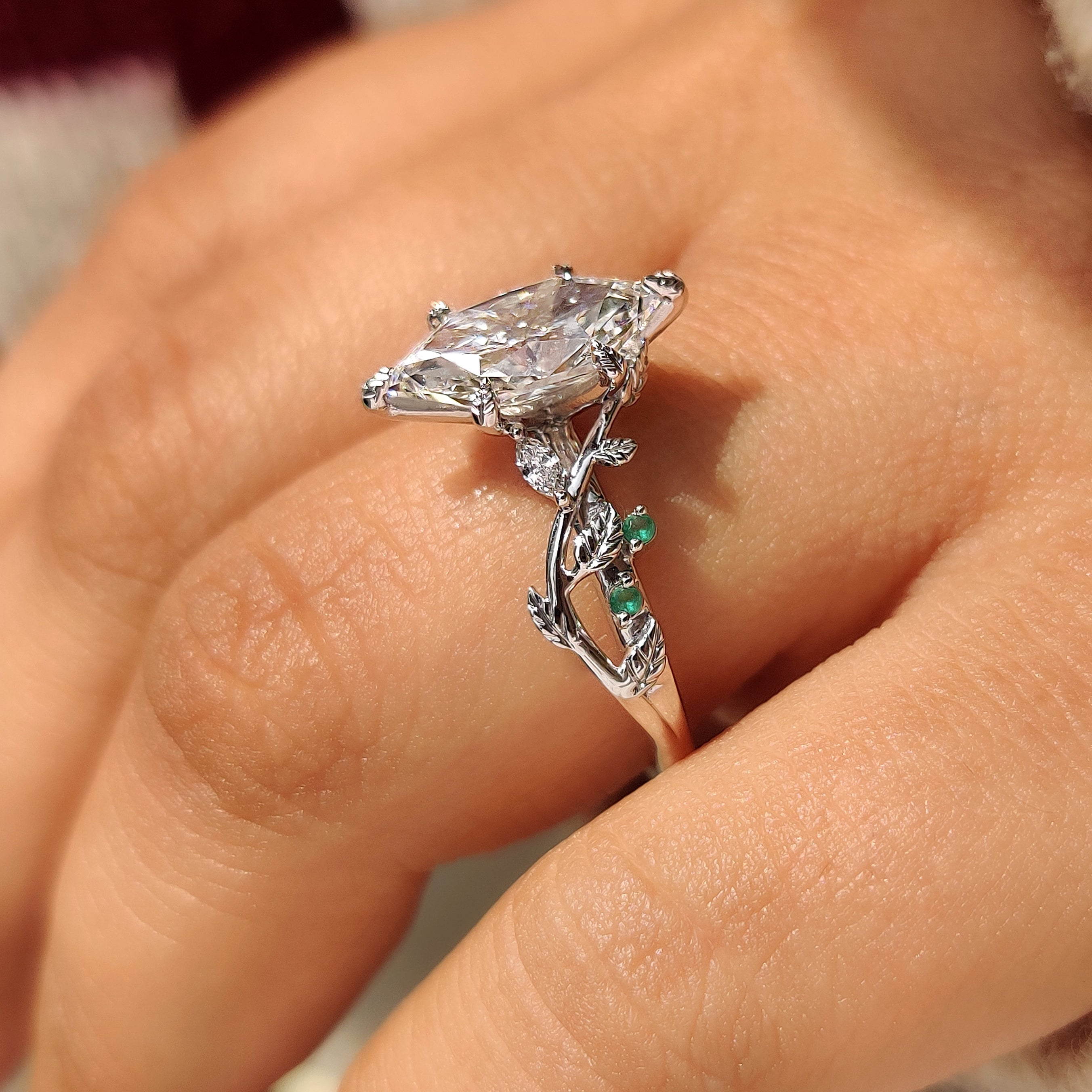 Dutch marquise ring with cluster setting and leaf prongs
