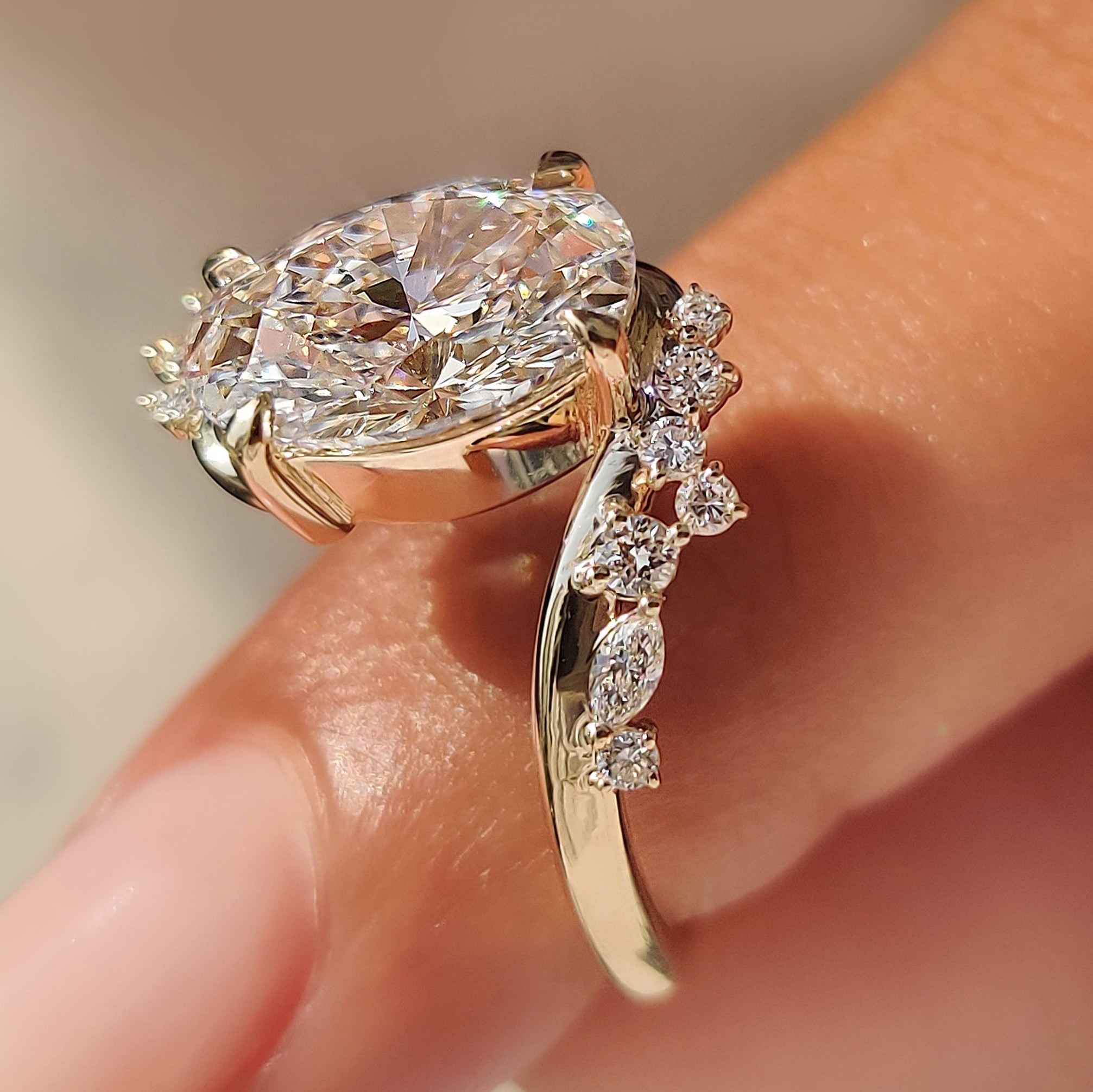 Open gallery oval diamond ring with bypass setting.
