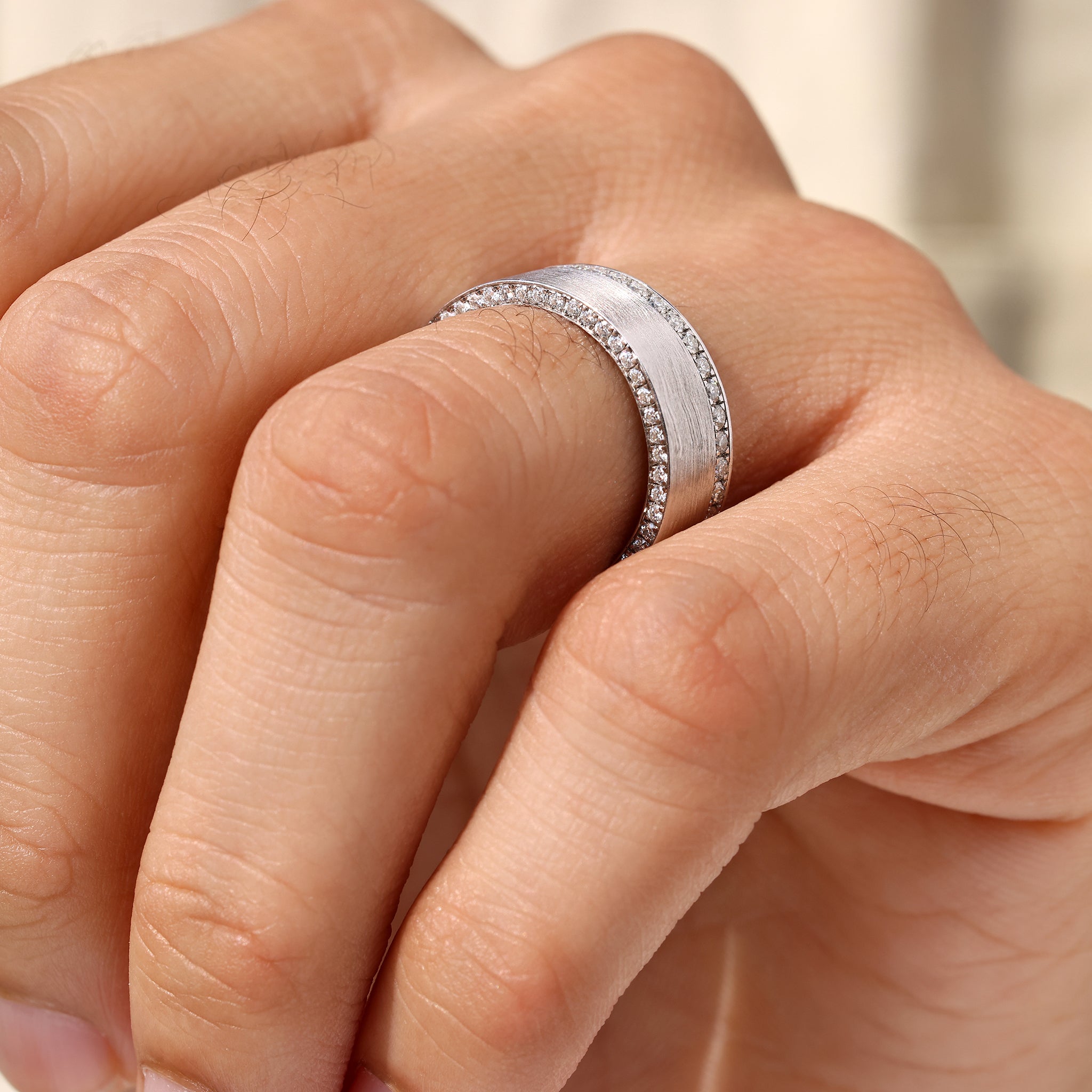 Matte finish men’s ring with round cut pave stones.
