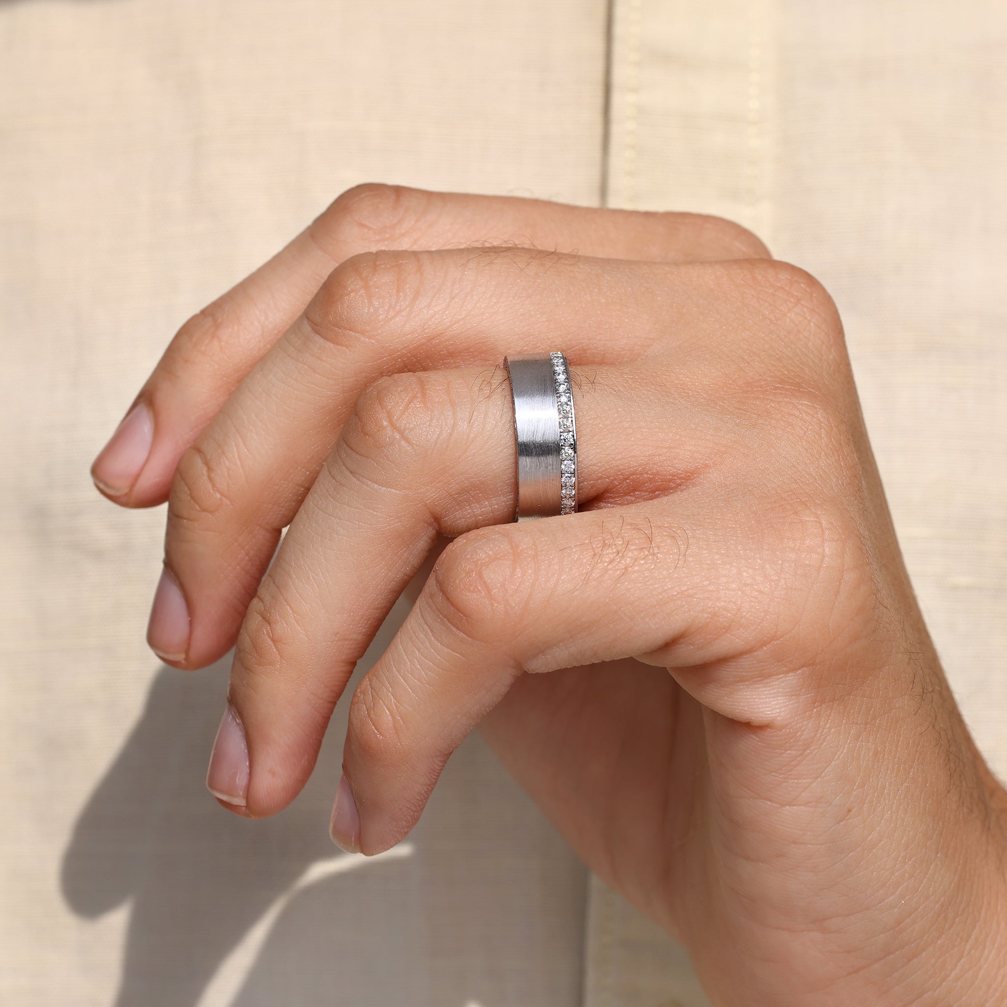 Matte finish men’s round cut ring crafted by Carat Diamonds.