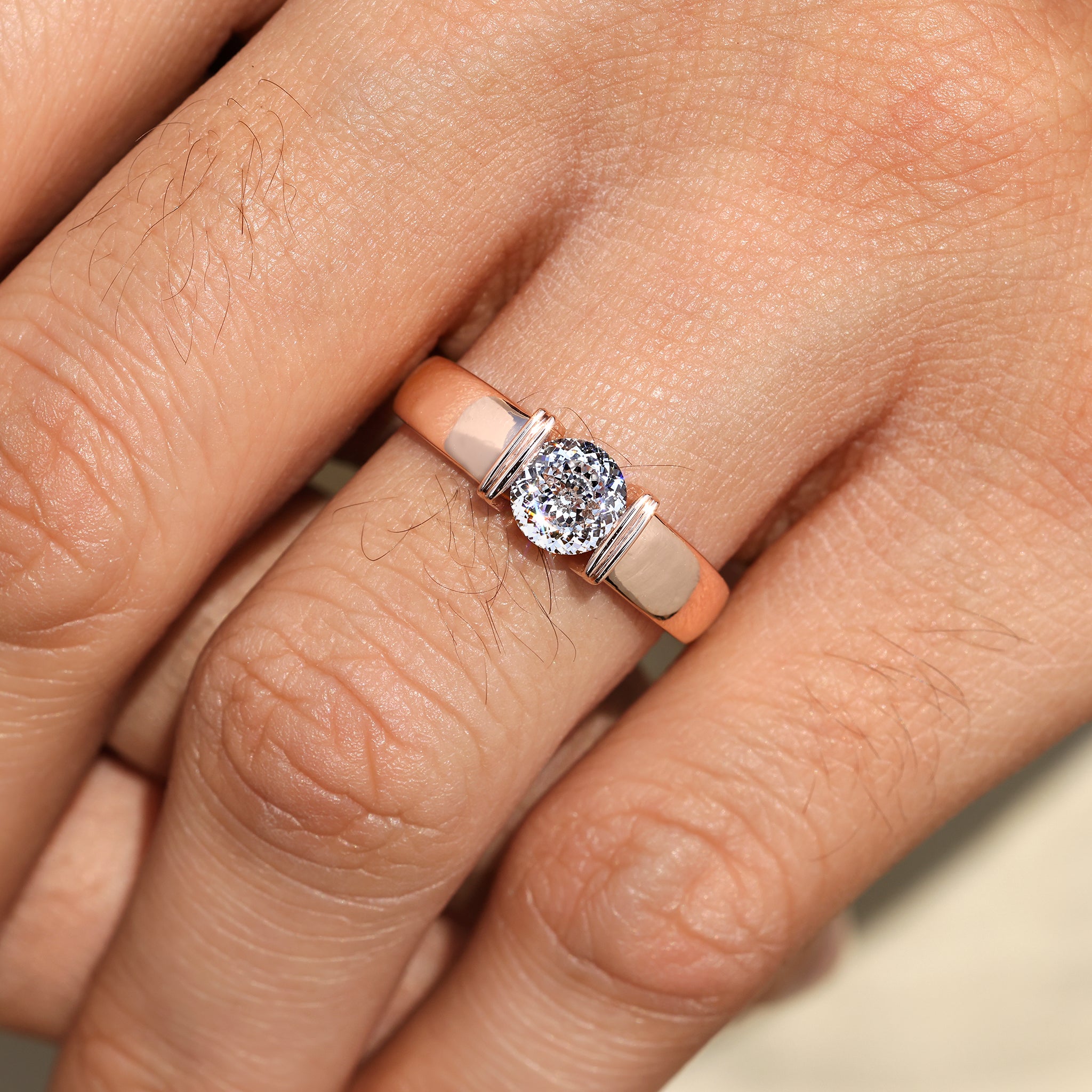 Tapered shank men’s ring featuring Portuguese cut stone.
