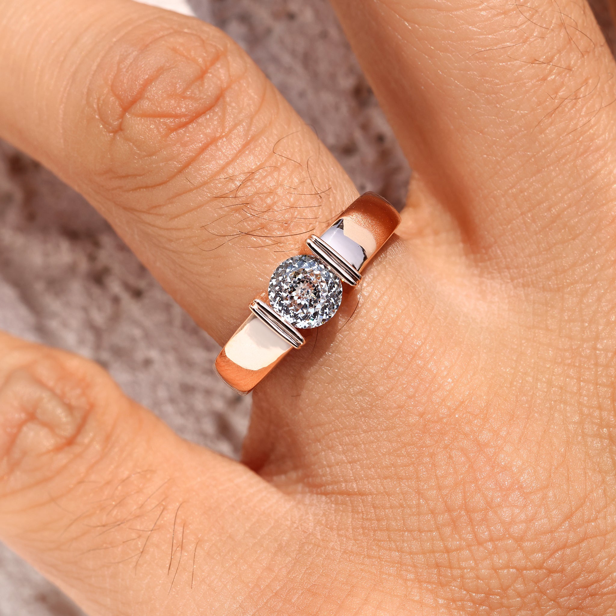 Men’s solitaire ring with Portuguese cut stone and tapered shank.
