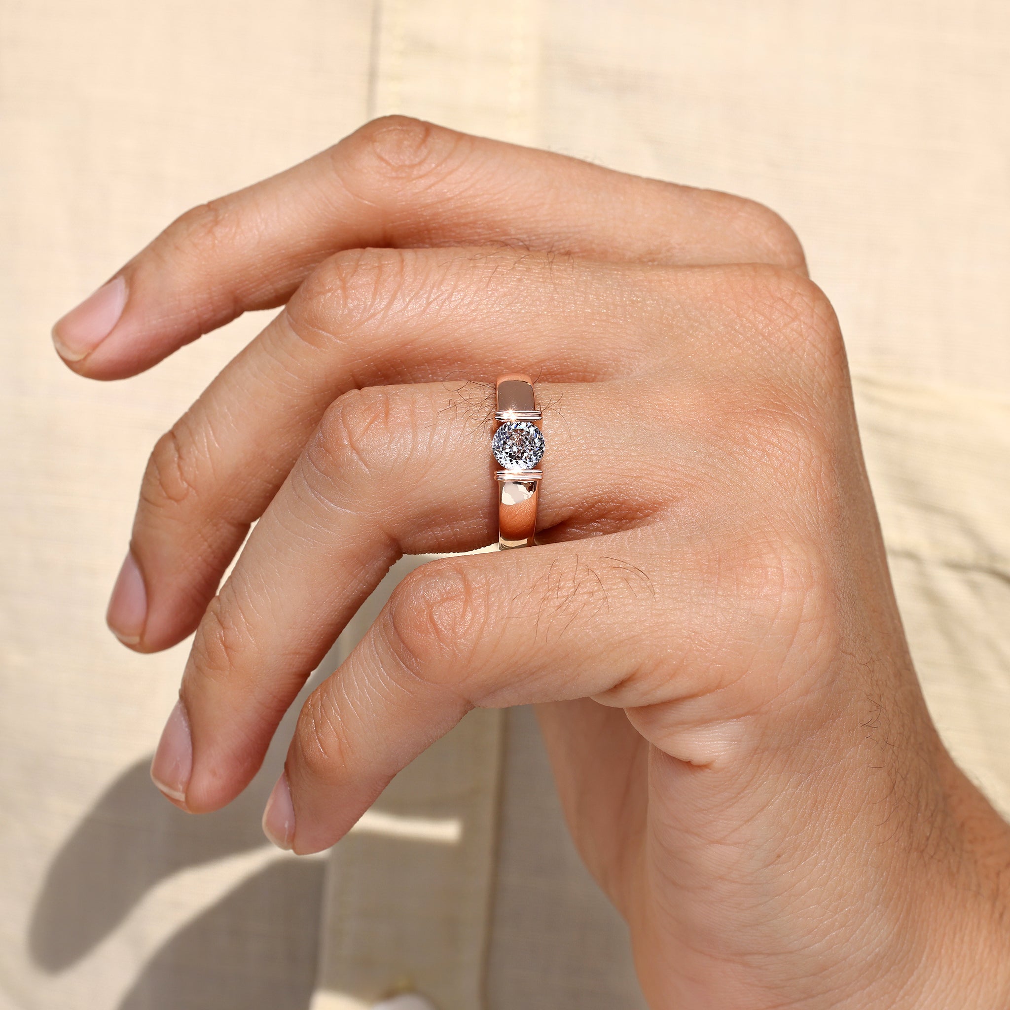 Men’s Portuguese cut solitaire ring with modern structure.

